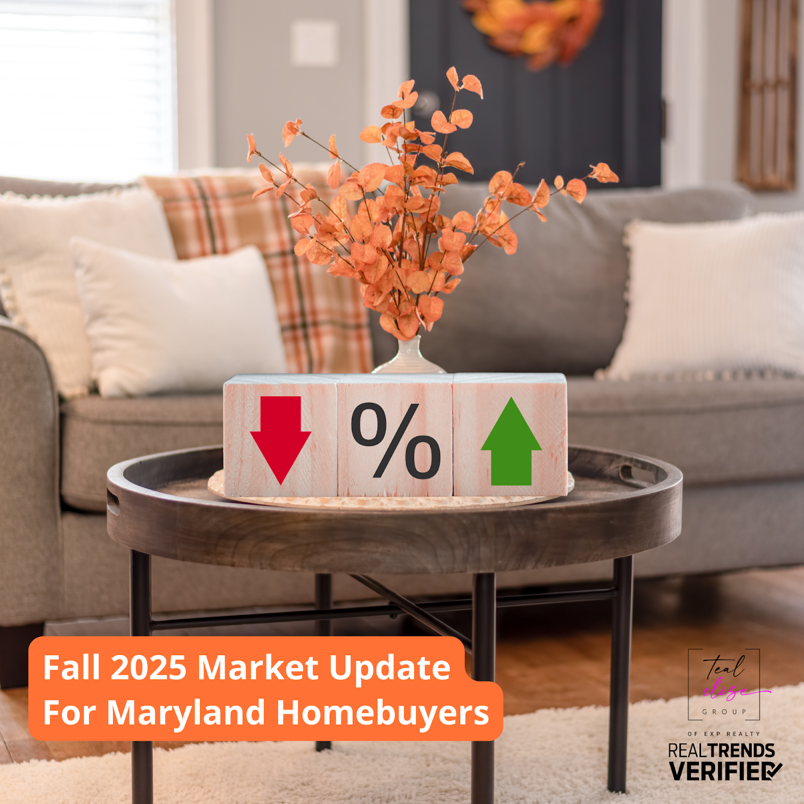 A cozy Maryland living room decorated for fall with a small table showing wooden blocks featuring a red down arrow, a percent sign, and a green up arrow, symbolizing changing mortgage rates in the Maryland housing market for fall 2025.