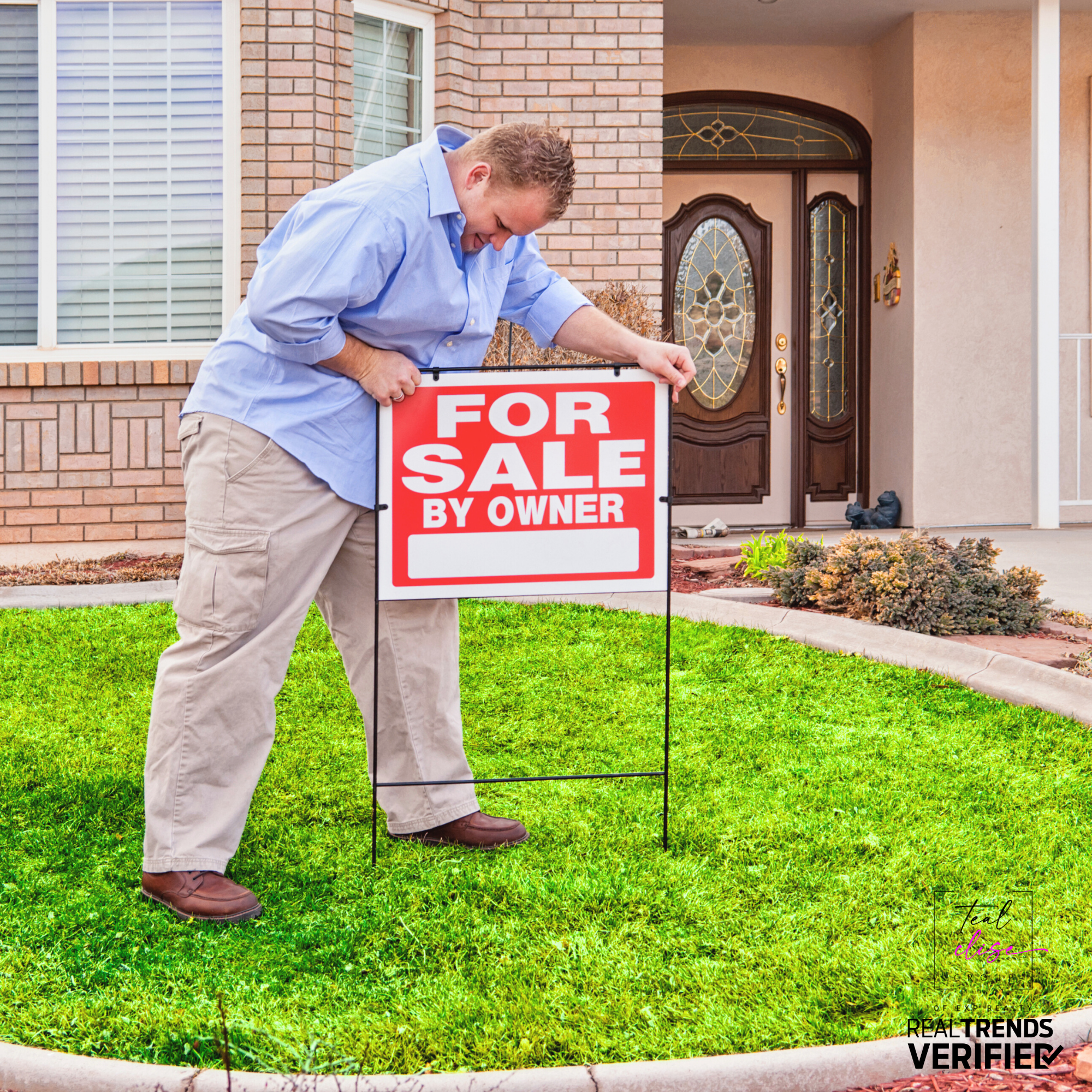 A man in a blue shirt and khaki pants places a red 