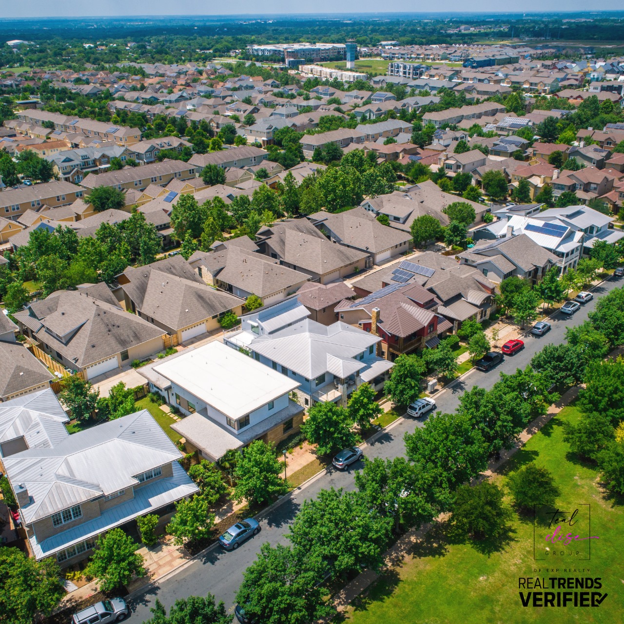 Aerial view of a well-planned suburban neighborhood in Maryland with tree-lined streets, modern single-family homes, and a blend of rooftops, representing the diverse and livable communities across Anne Arundel, Howard, Carroll, Baltimore, Harford, and Cecil Counties.
