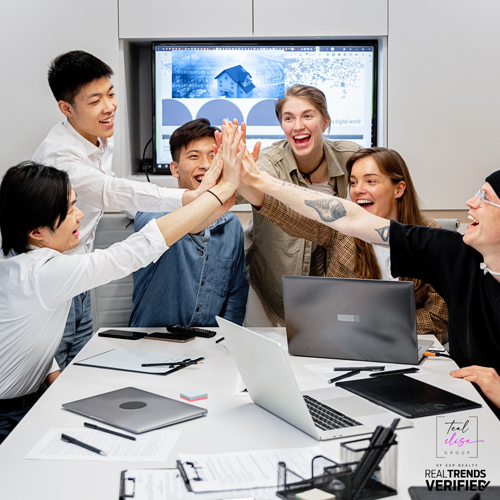 Real estate team giving a high five, celebrating teamwork, success, and collaboration