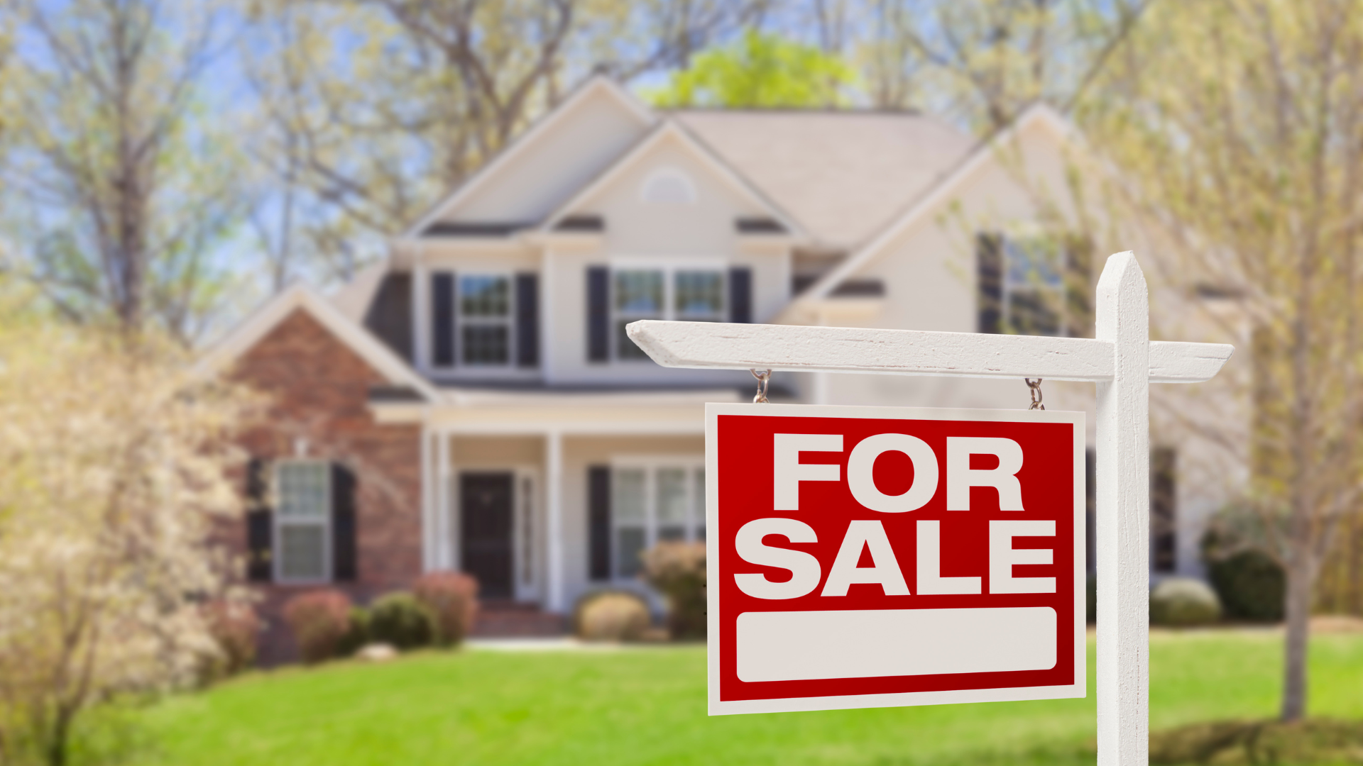 For Sale' sign placed in front yard of a home ready to go on the market.