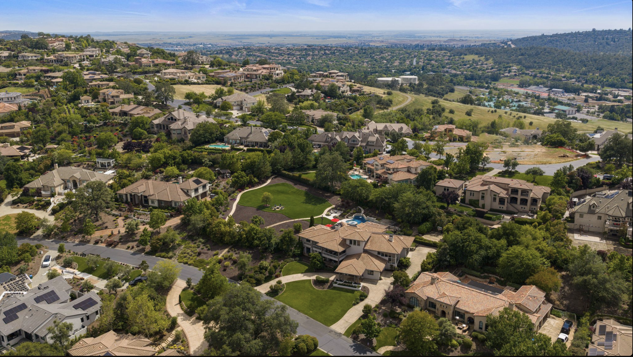 Aerial view of an El Dorado Hills neighborhood at dusk, used to illustrate Prop 19 California real estate planning impact