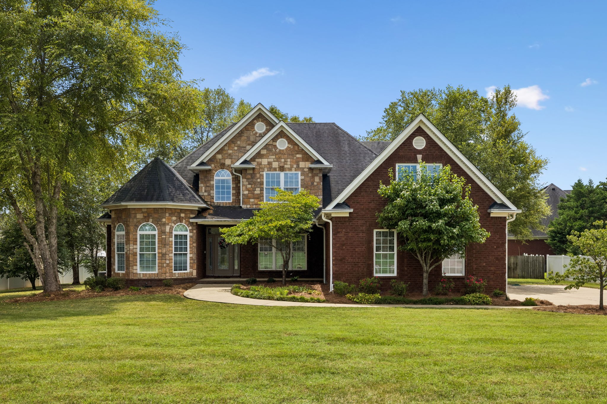 All-Brick Luxury Home with Dual Fireplaces, Wet Bar Lounge & Outdoor Fire Pit — Built for Impressive Living header image.