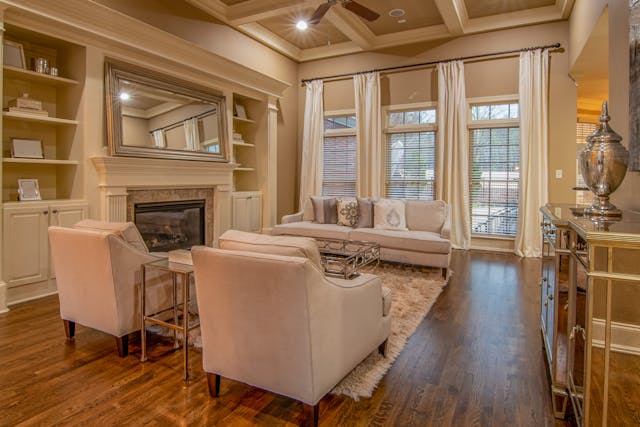 Bright and airy spring living room with calming neutral tones, soft textures, and natural light creating a peaceful sanctuary at home.