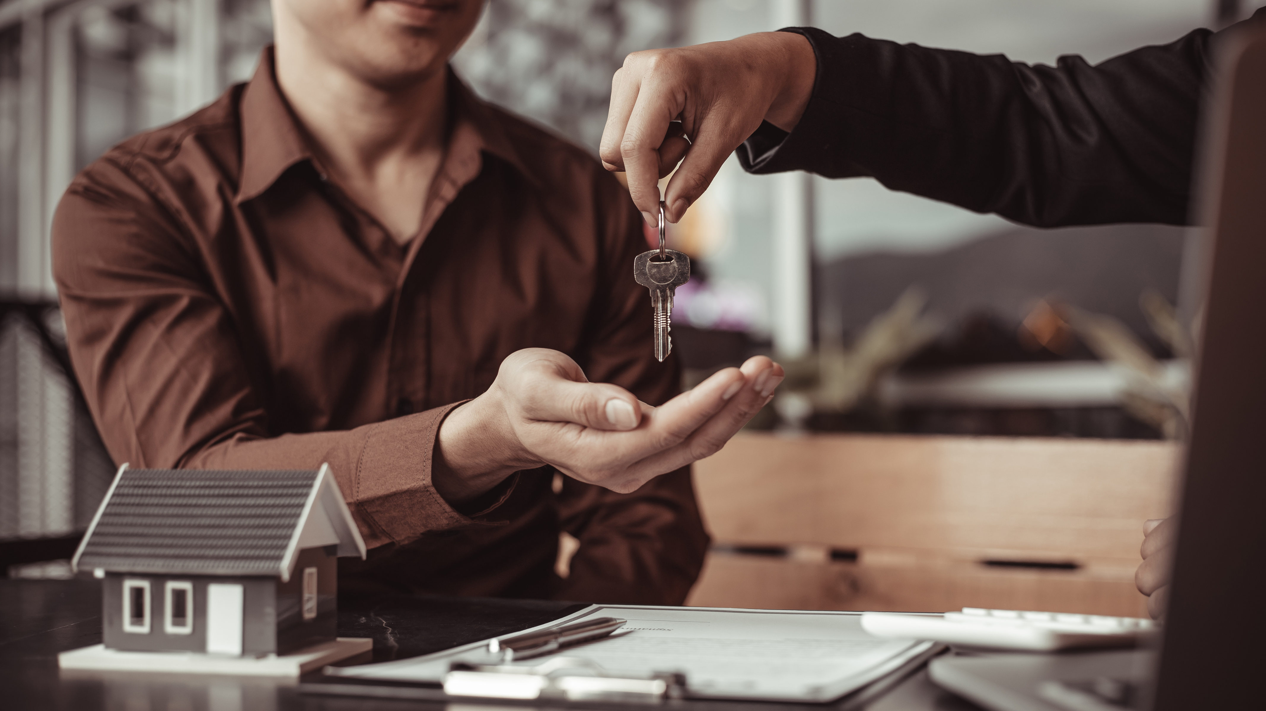 Handing keys to buyer