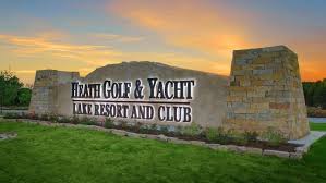 Lit Heath Golf & Yacht Club Sign with sunset behind