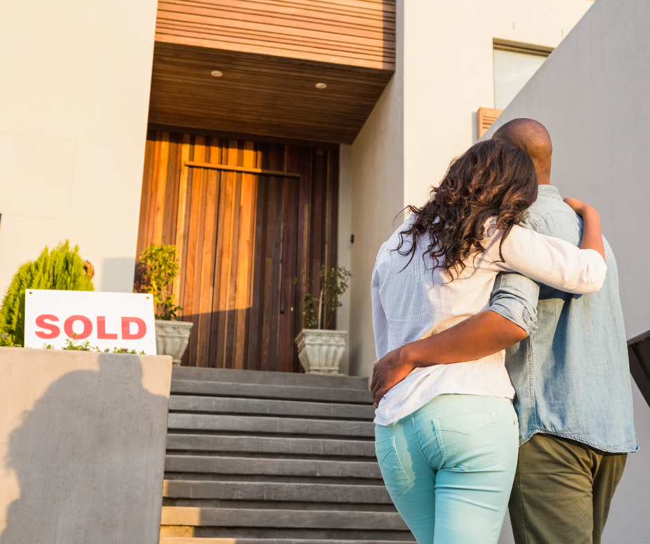 buying-home-lincoln-select-real-estate-top-trusted-agent-broker-couple-sold-signage-by-the-front-door-nebraska-PLACE-12.05.2025