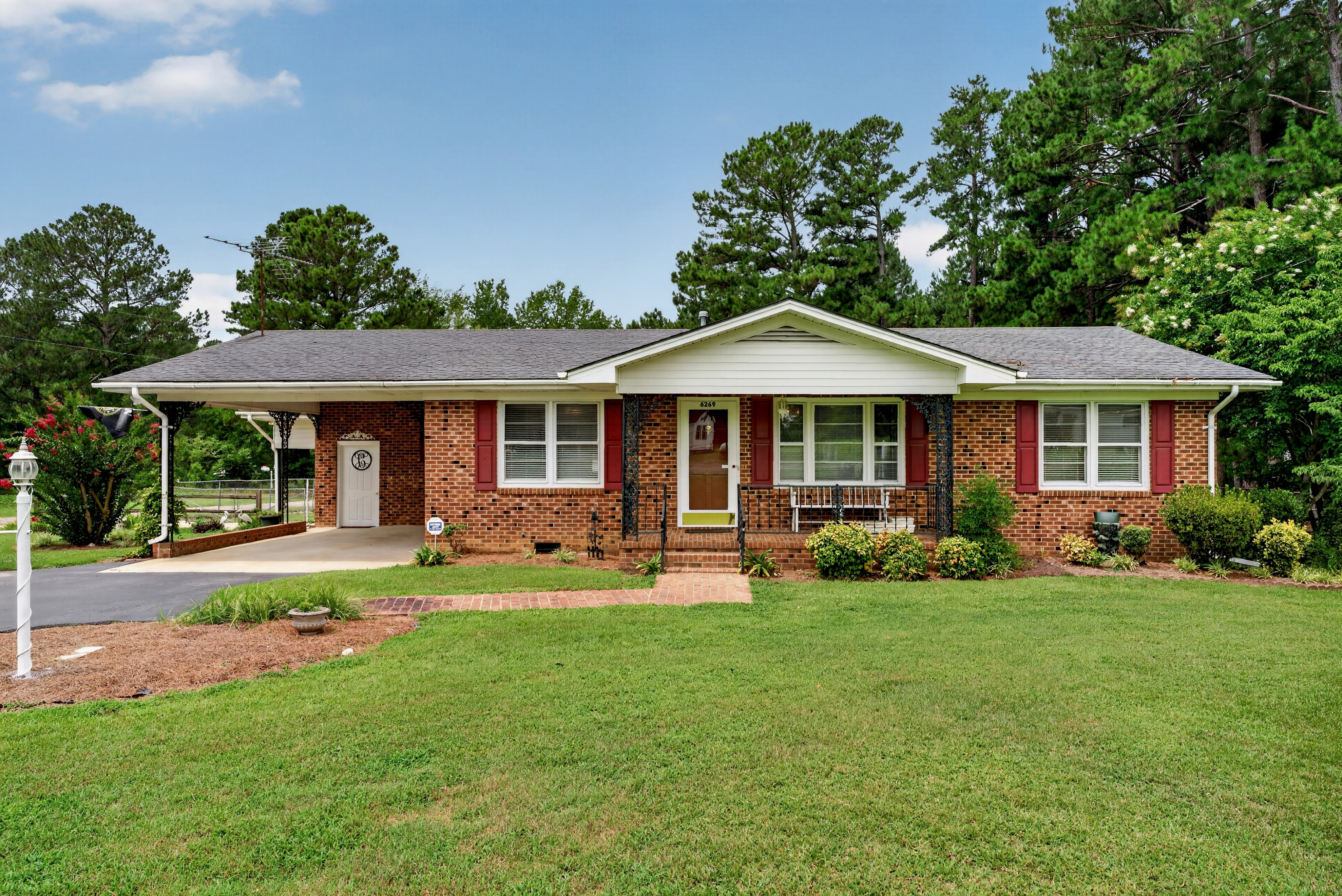 6269 Flower Hill Rd: A Peaceful Brick Ranch Homestead With Room to Grow header image.