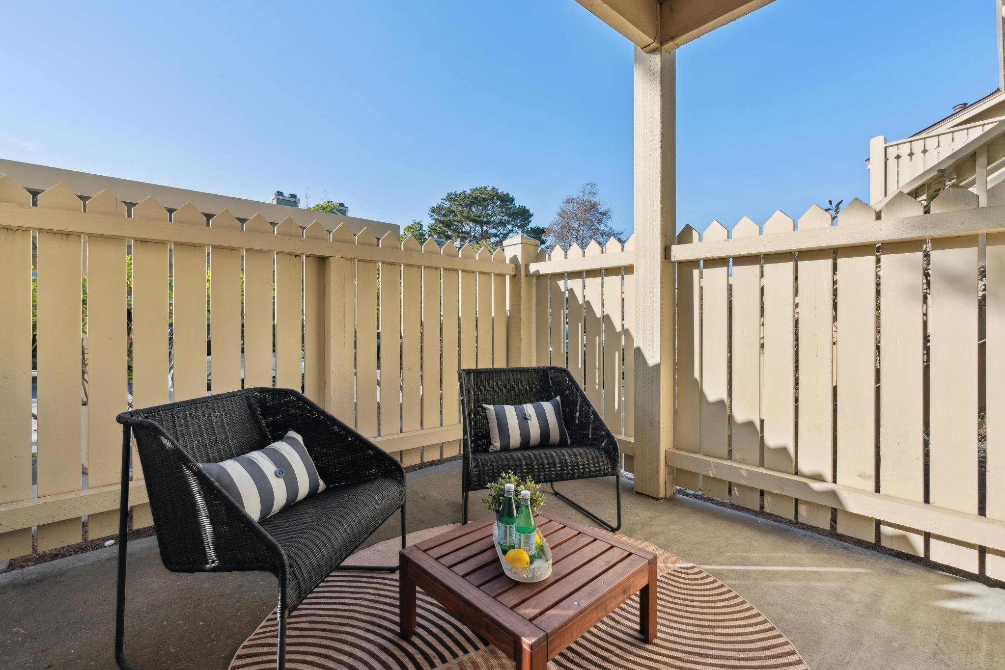 Private fenced patio with seating at 79 Lakeshore Ct, Richmond