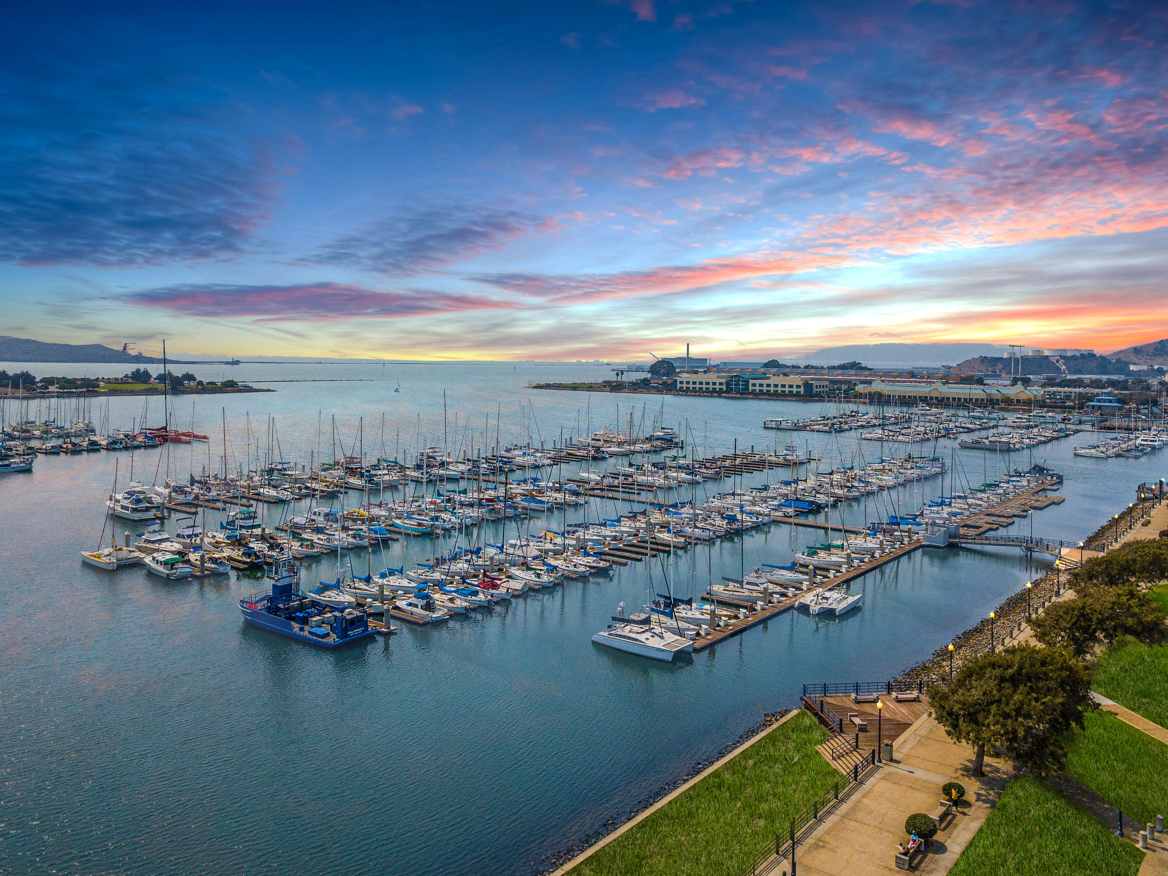 Sunset over Marina Bay harbor and sailboats in Marina Bay, Richmond CA.