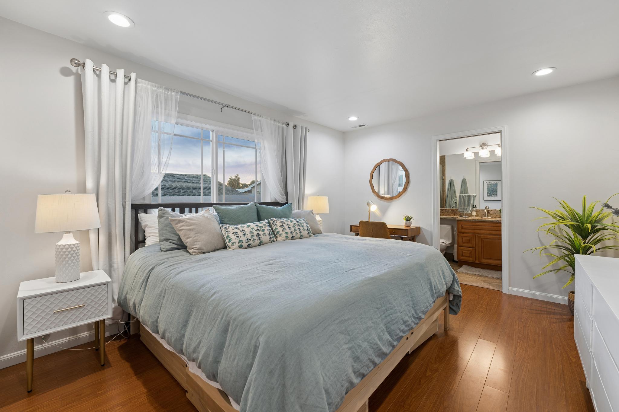 Primary bedroom with private bathroom access at 1390 E 31st St in Oakland, CA