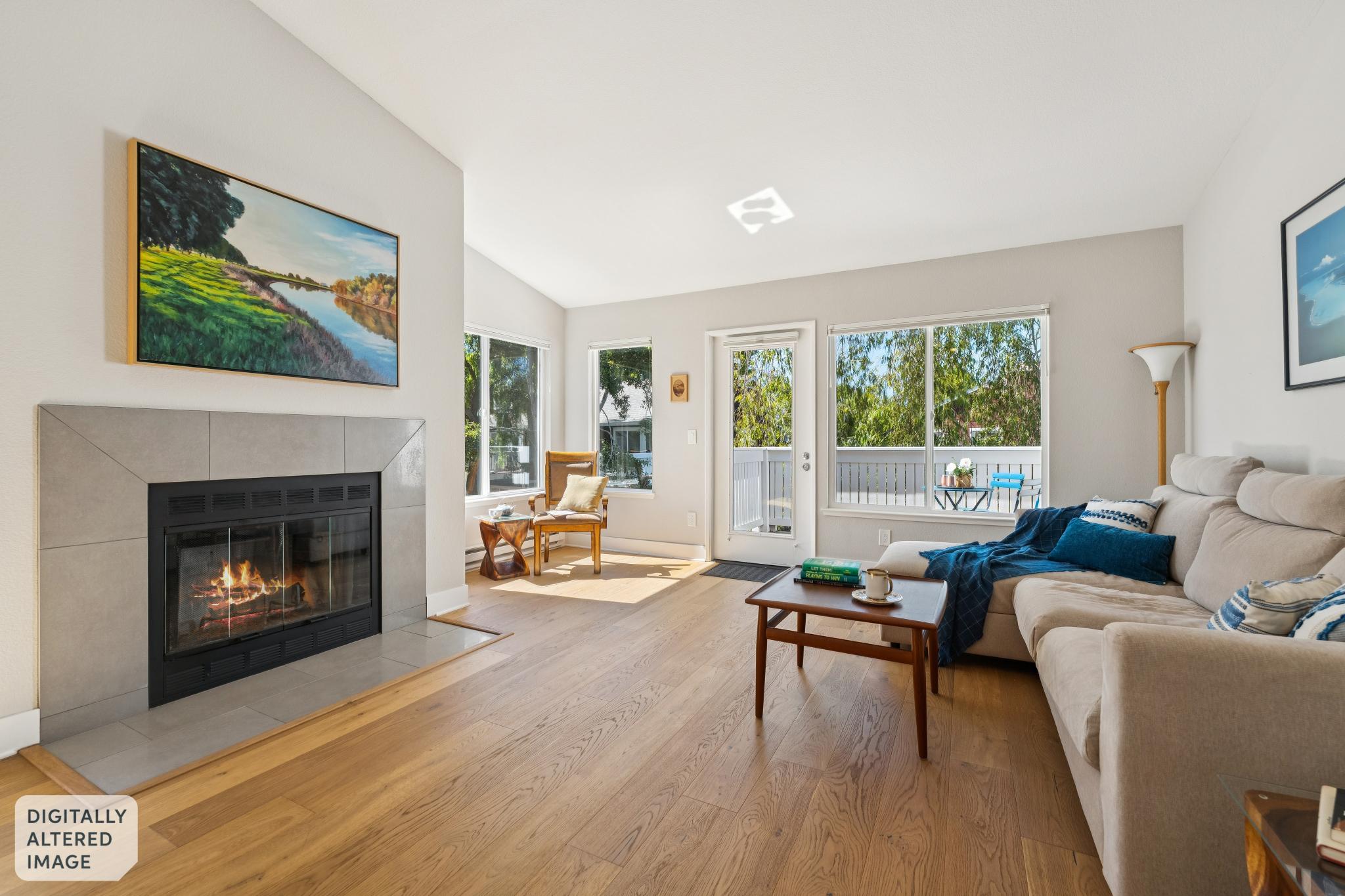 Living room with wood-burning fireplace at 12 Bayside Ct in Marina Bay, Richmond, California