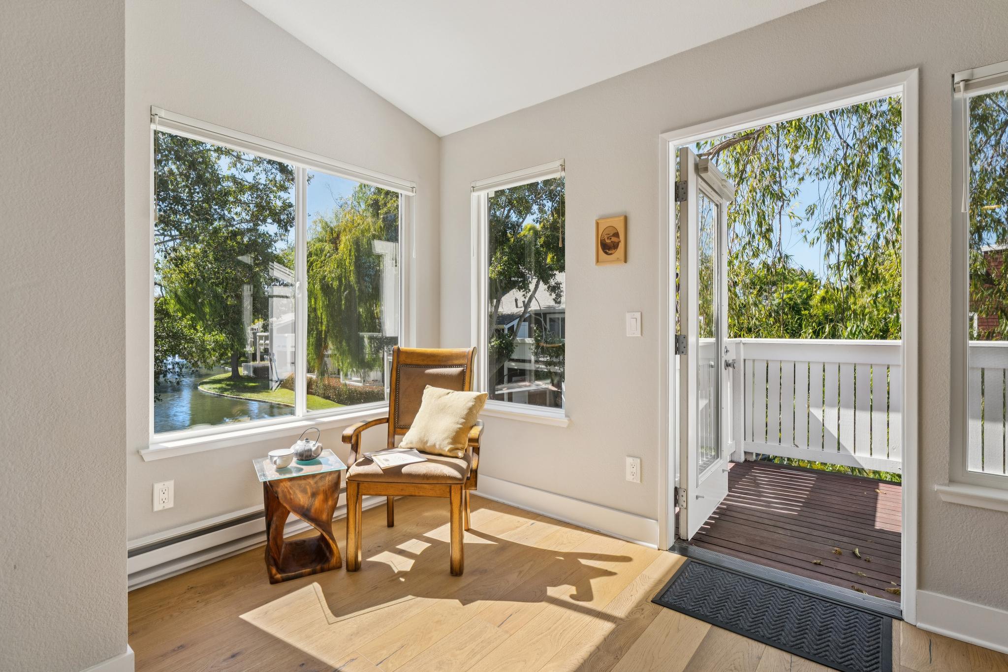 Corner windows and balcony access at 12 Bayside Ct in Marina Bay, Richmond, California