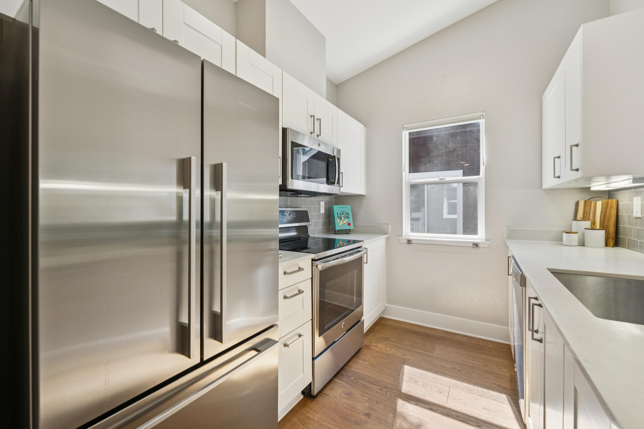 Kitchen with stainless-steel appliances at 12 Bayside Ct in Marina Bay, Richmond, California