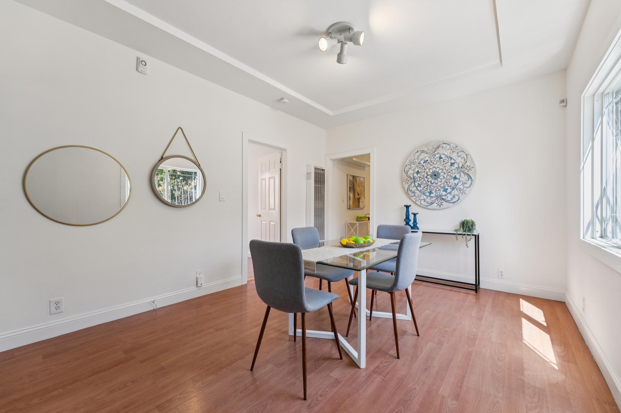 Dining area at 220 Marina Way in Richmond with wood flooring and a bright window