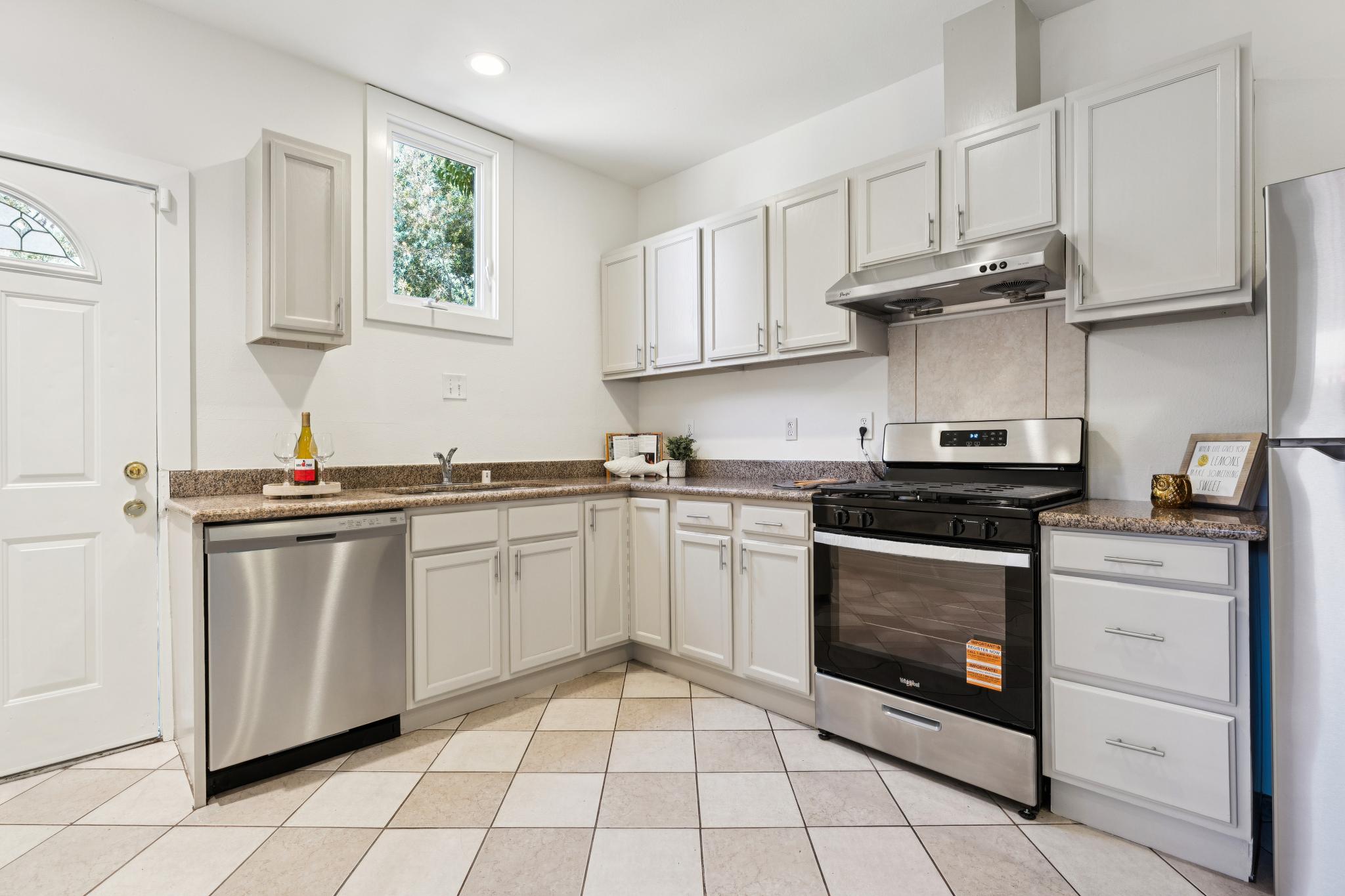 Kitchen at 220 Marina Way in Richmond with white cabinets and stainless steel appliances
