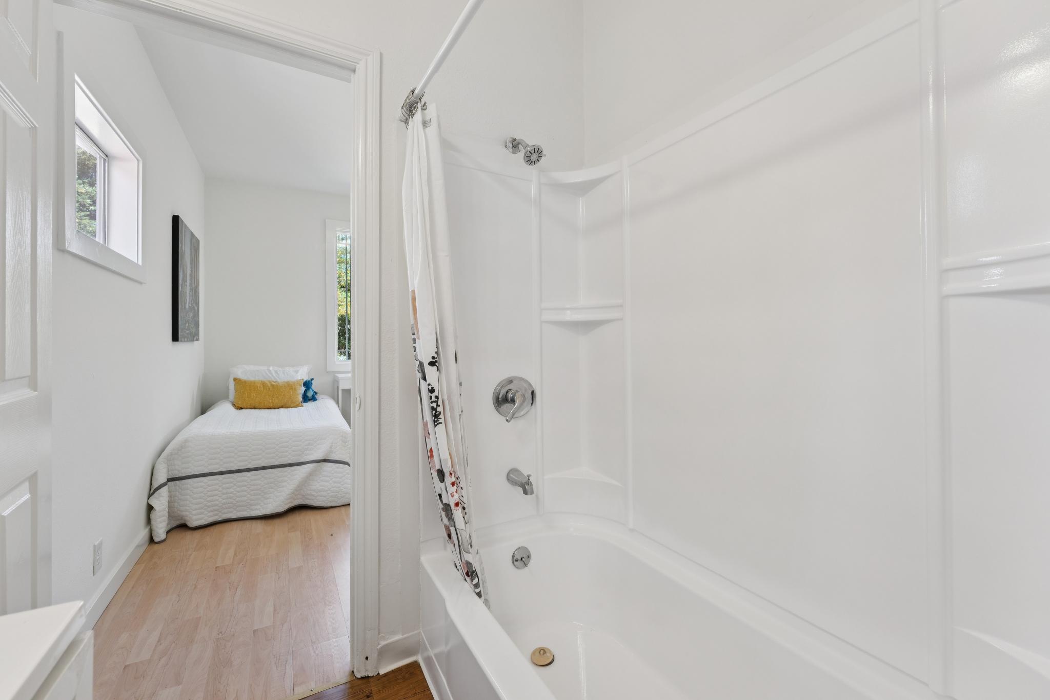 Full bathroom at 220 Marina Way in Richmond with tub and shower surround