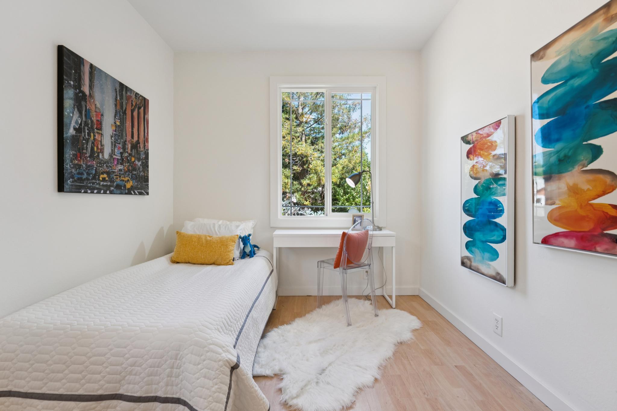 Second bedroom at 220 Marina Way in Richmond with two windows and wood flooring