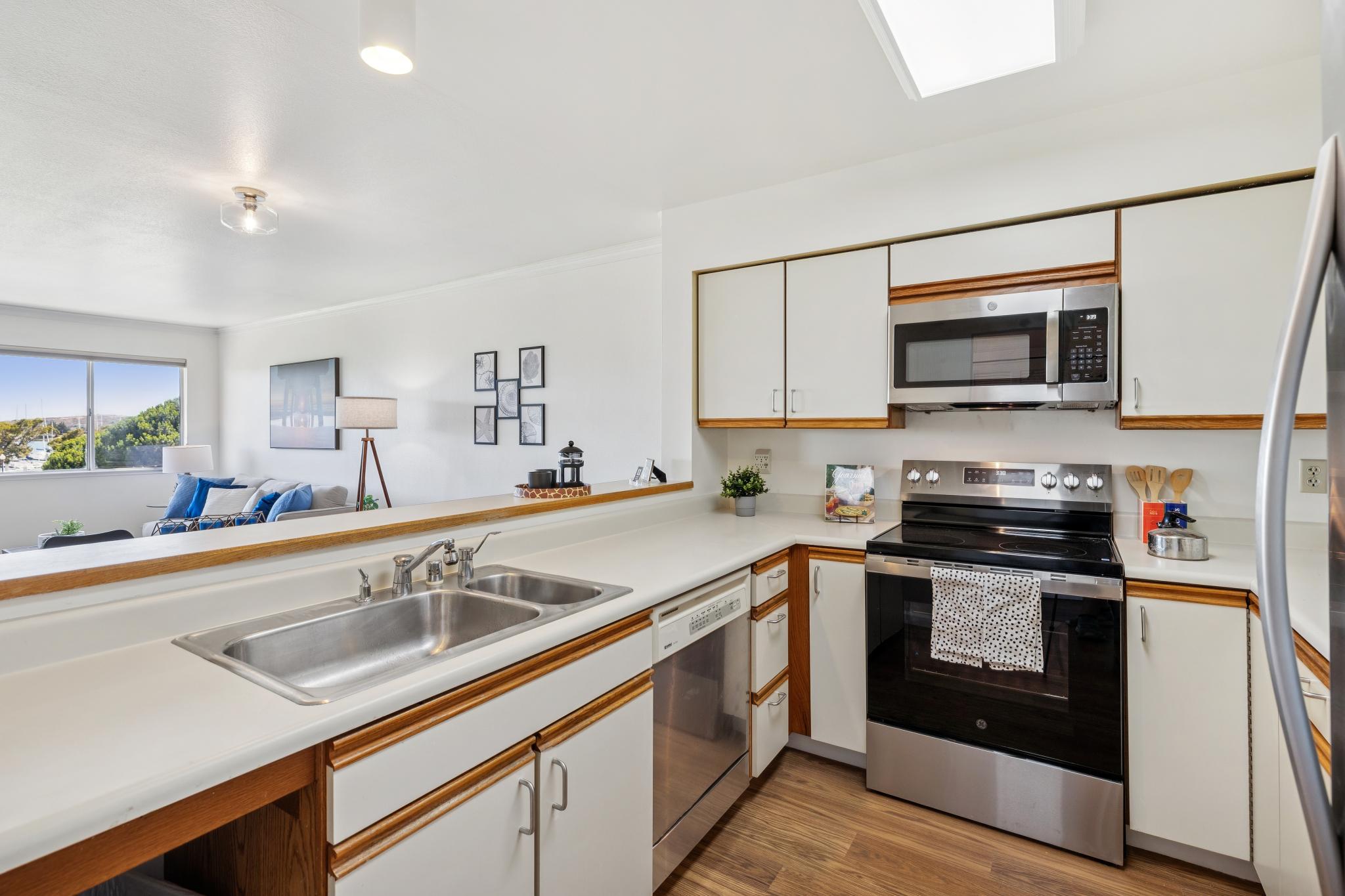 Kitchen with view toward the living room at 1205 Melville Sq #304 in Richmond
