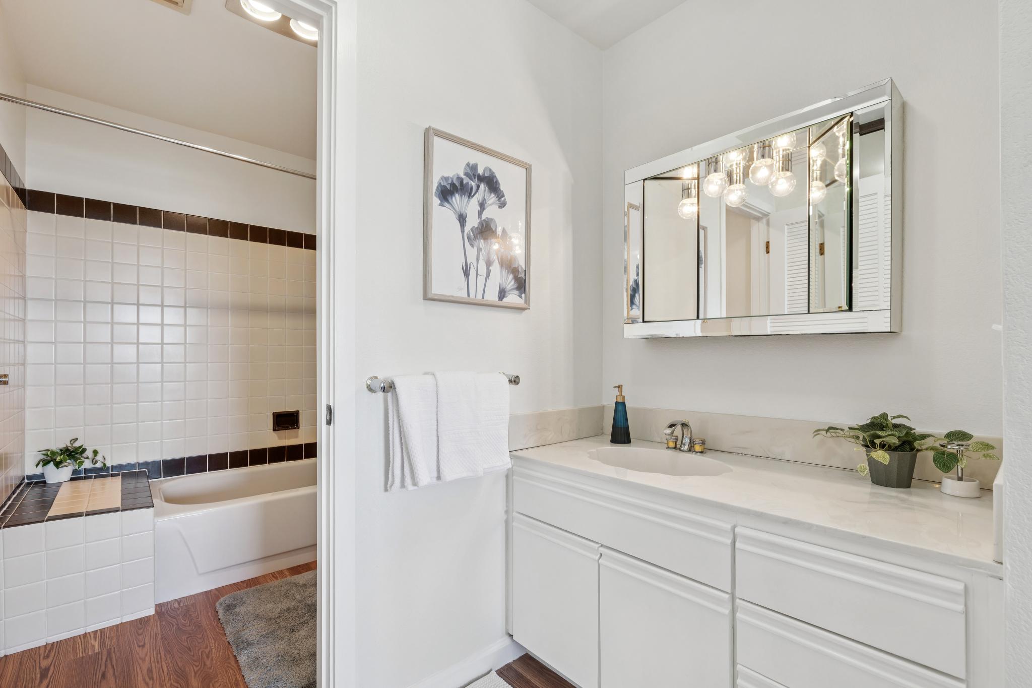 Bathroom vanity and tub at 1205 Melville Sq #304 in Richmond