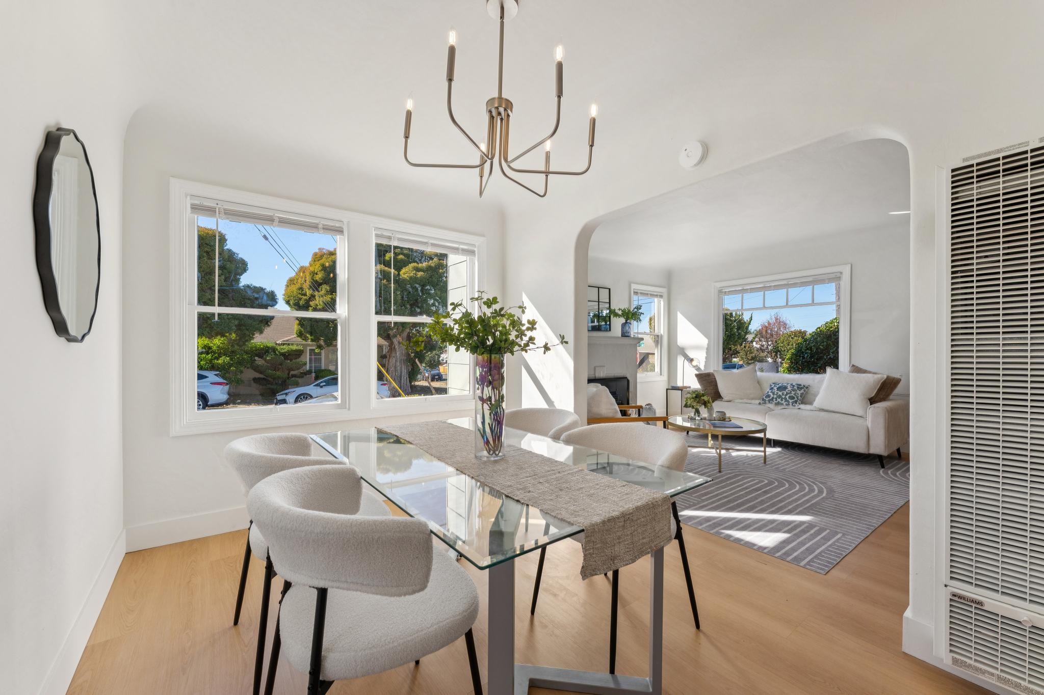 Dining room with an arched opening to the living room at 3400 McBryde Ave in North and East, Richmond, CA