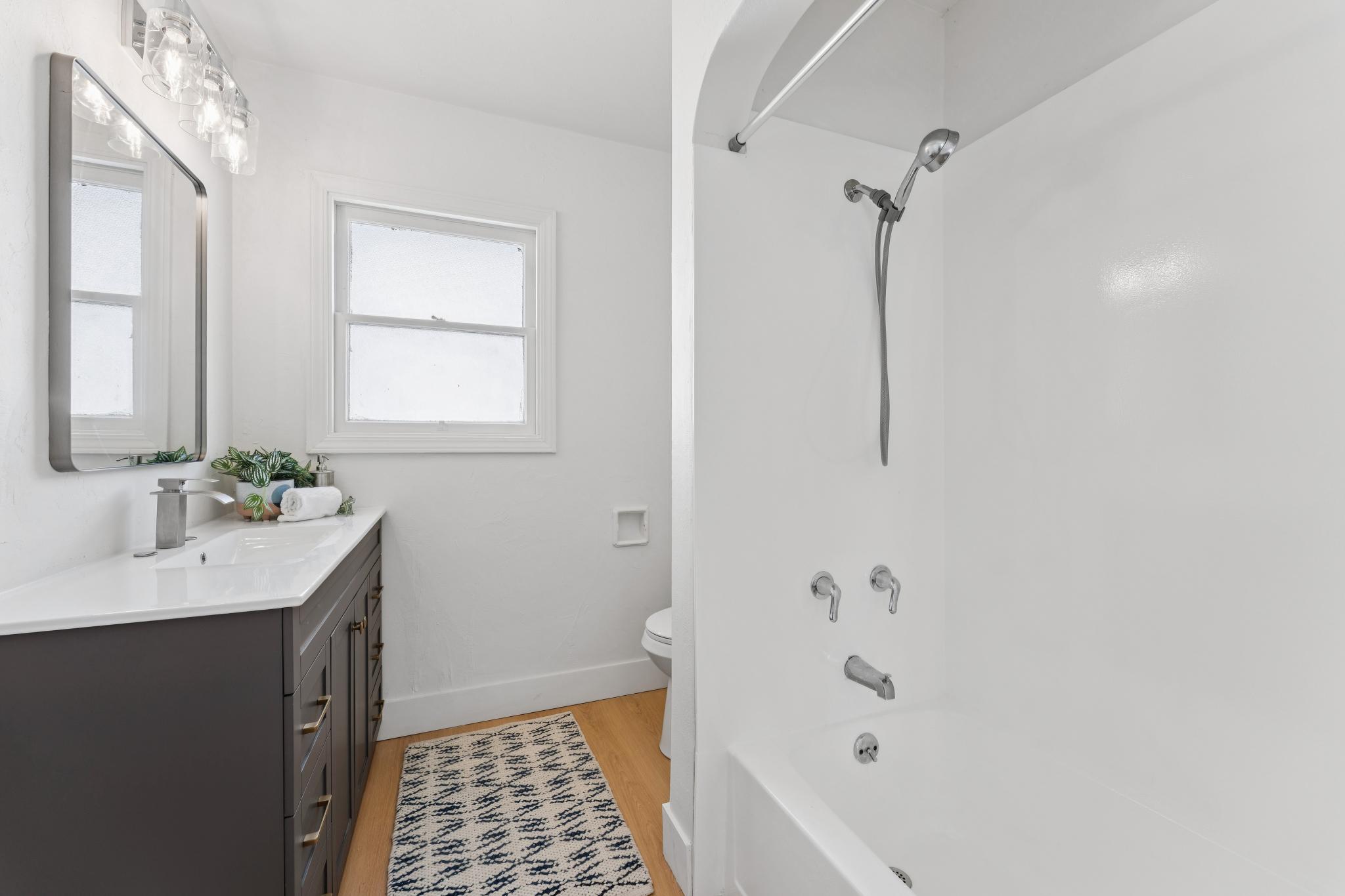 Full bathroom with vanity and shower over the tub at 3400 McBryde Ave in North and East, Richmond, CA