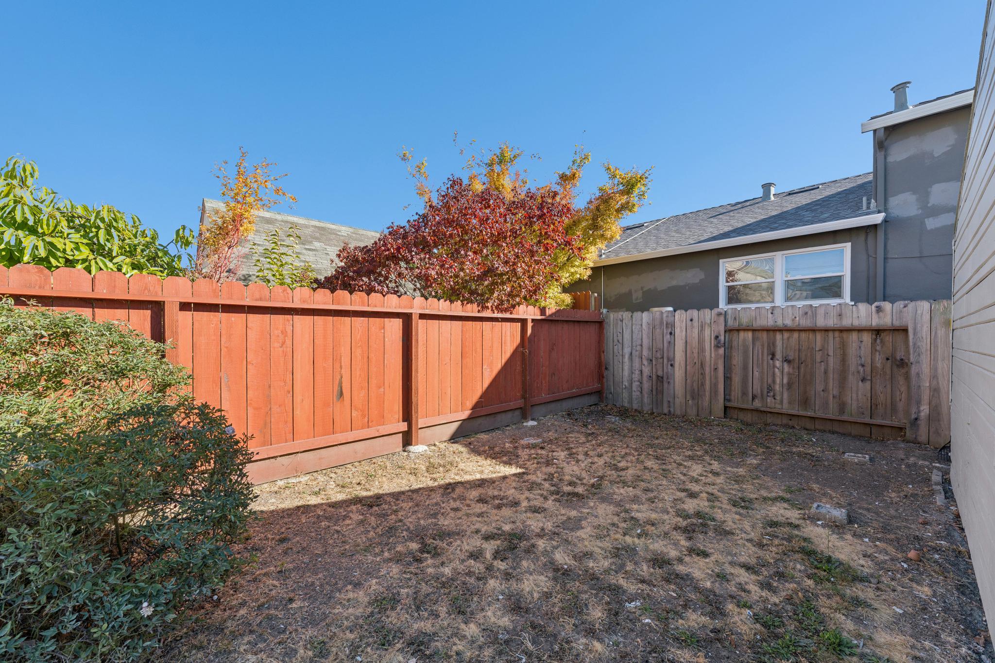 Fenced backyard with open garden space at 3400 McBryde Ave in North and East, Richmond, CA