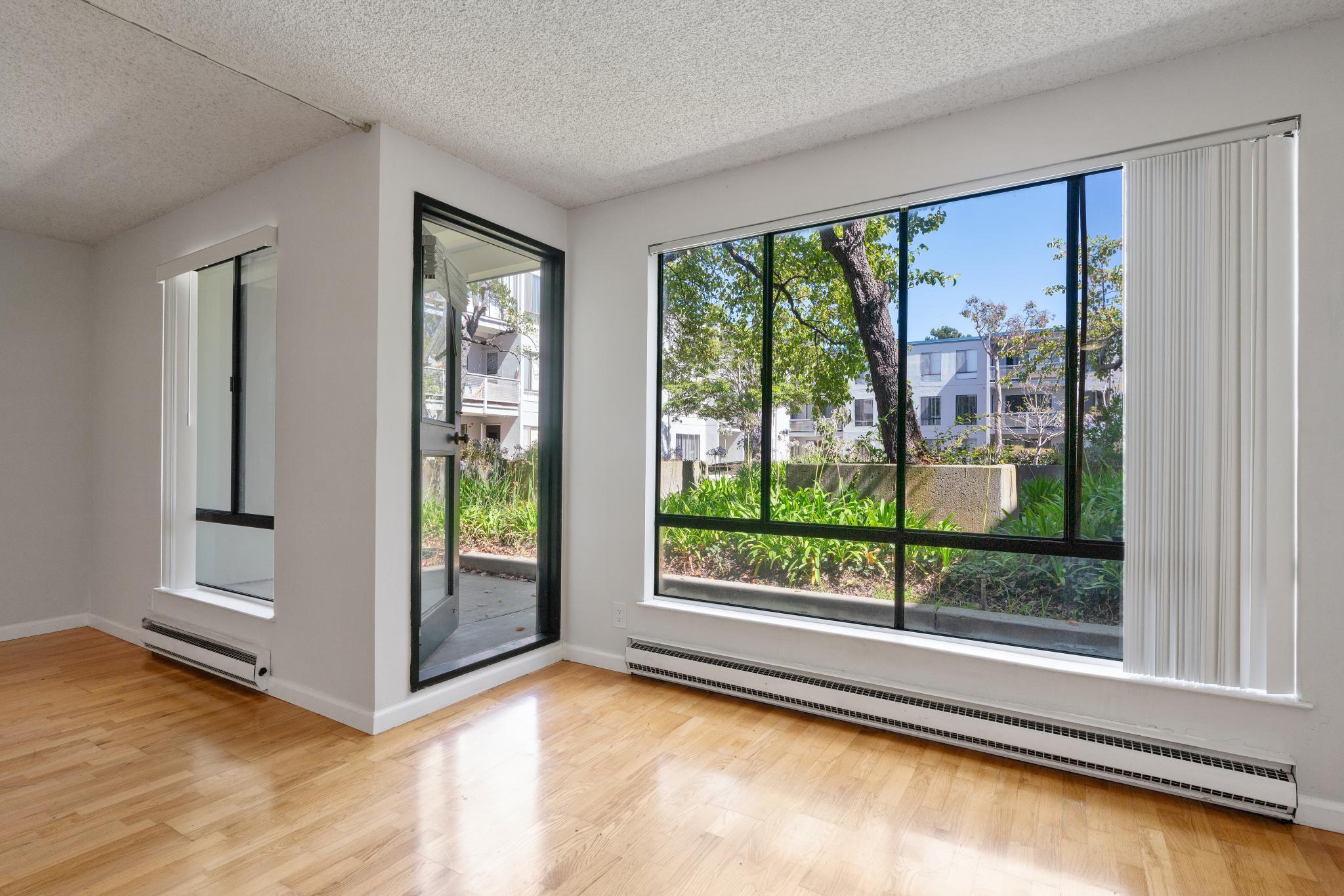 Bright courtyard-facing studio interior at 9 Commodore Dr A207 in Emeryville, California