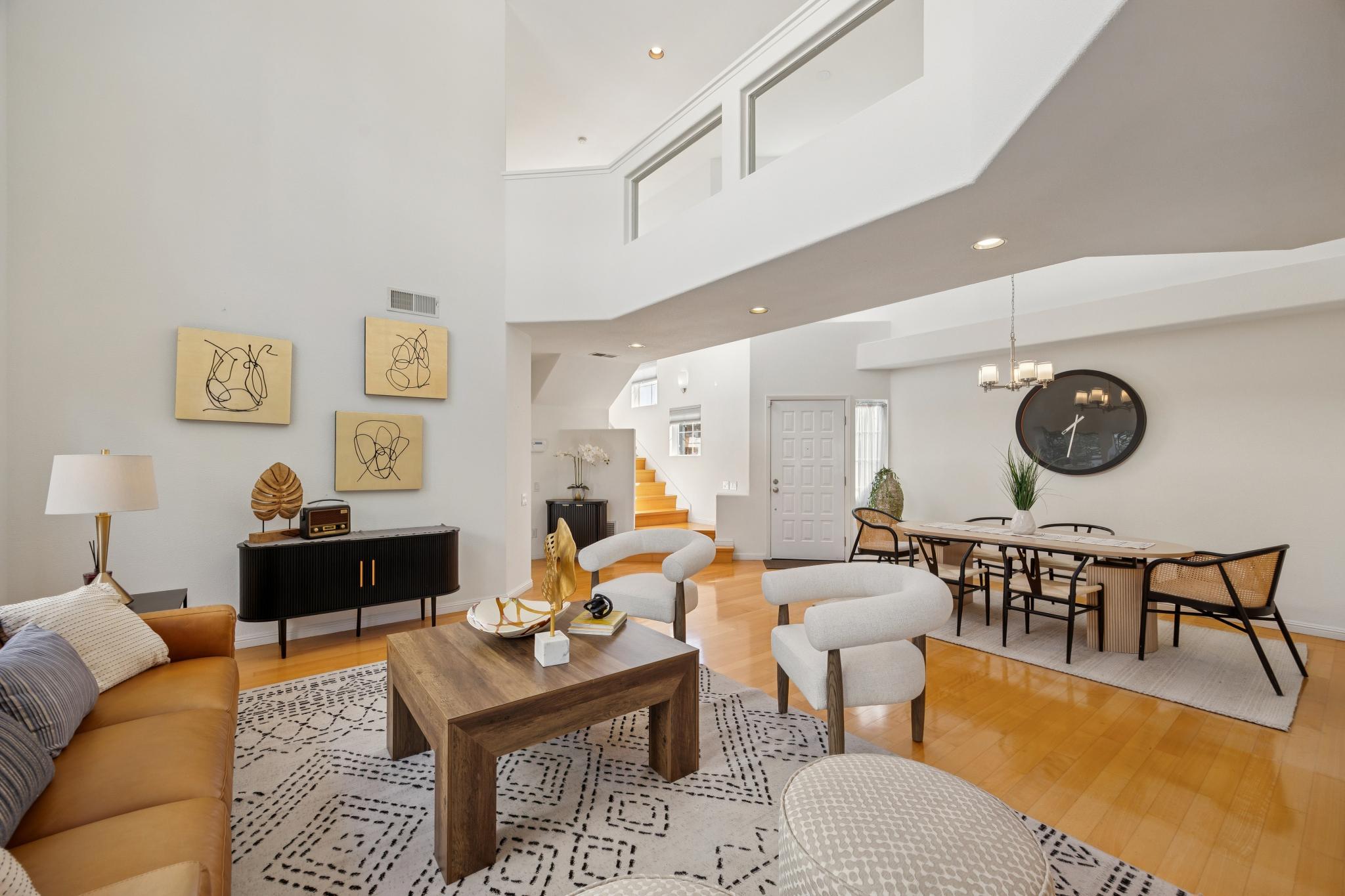 Open living and dining areas with tall ceilings at 65 Seagull Dr in The Breakers, Richmond
