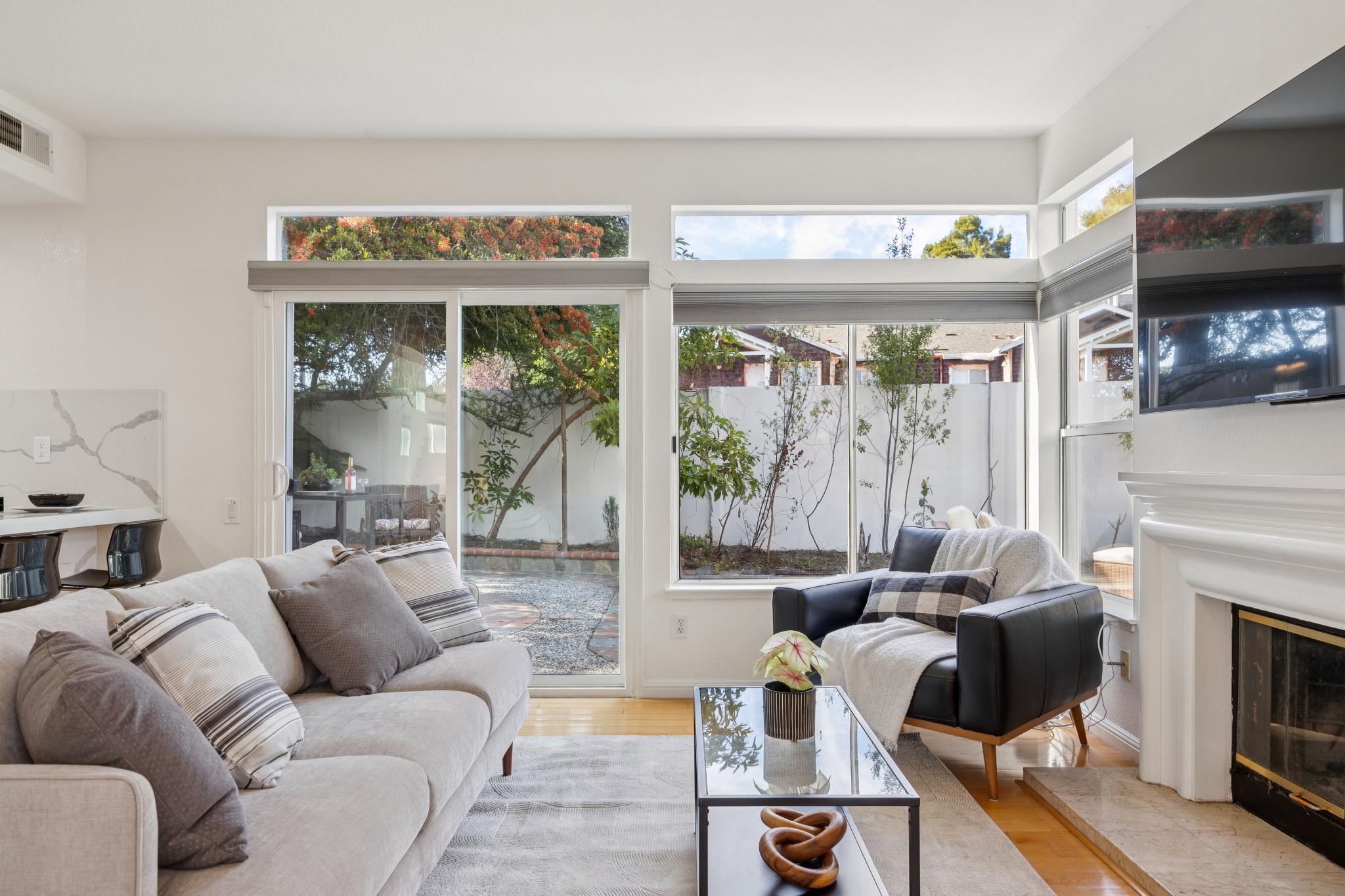 Living area with fireplace and backyard windows at 65 Seagull Dr in Richmond Marina Bay