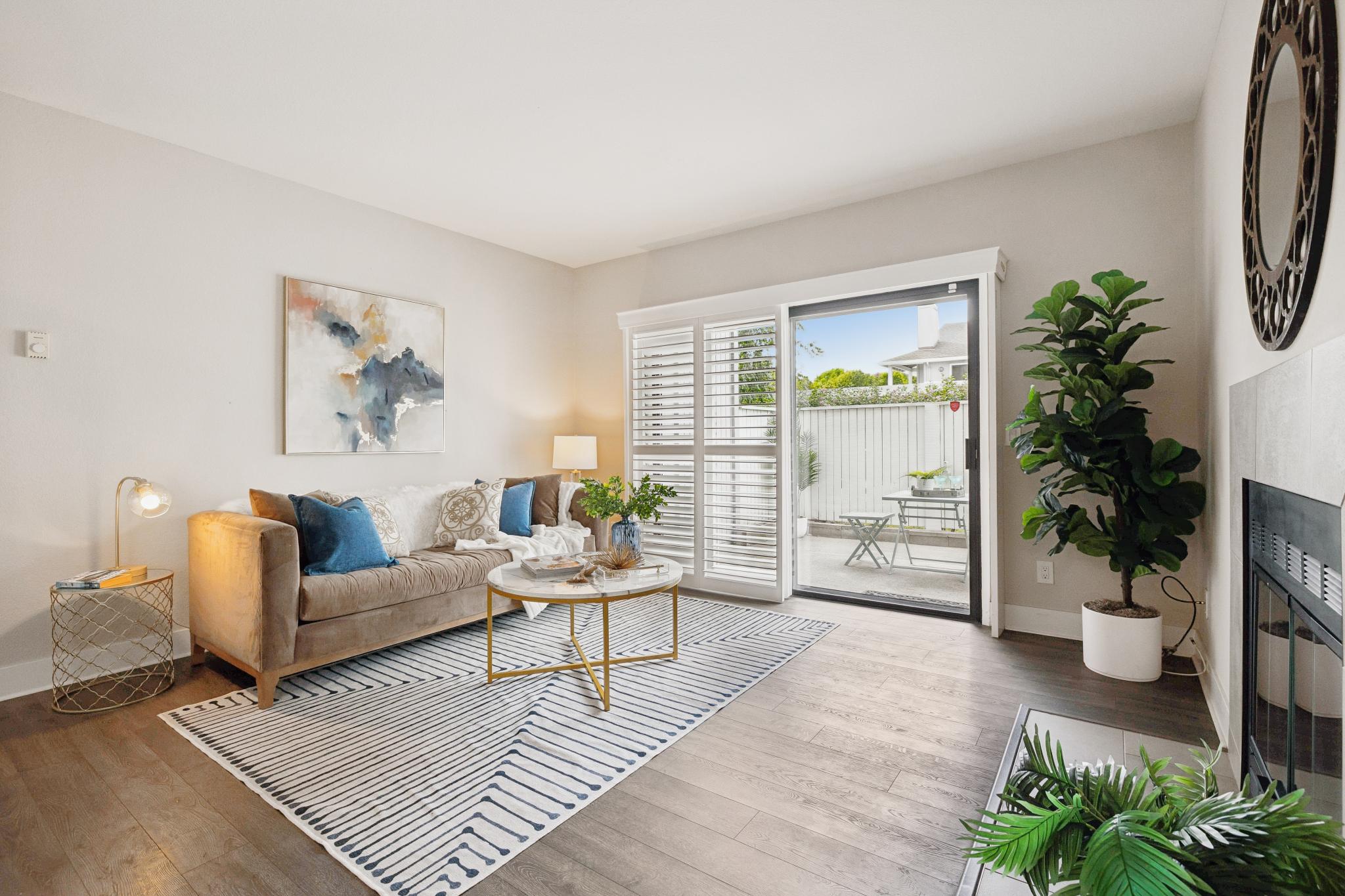 Living room with fireplace and patio door at 189 Schooner Ct in Marina Bay, Richmond