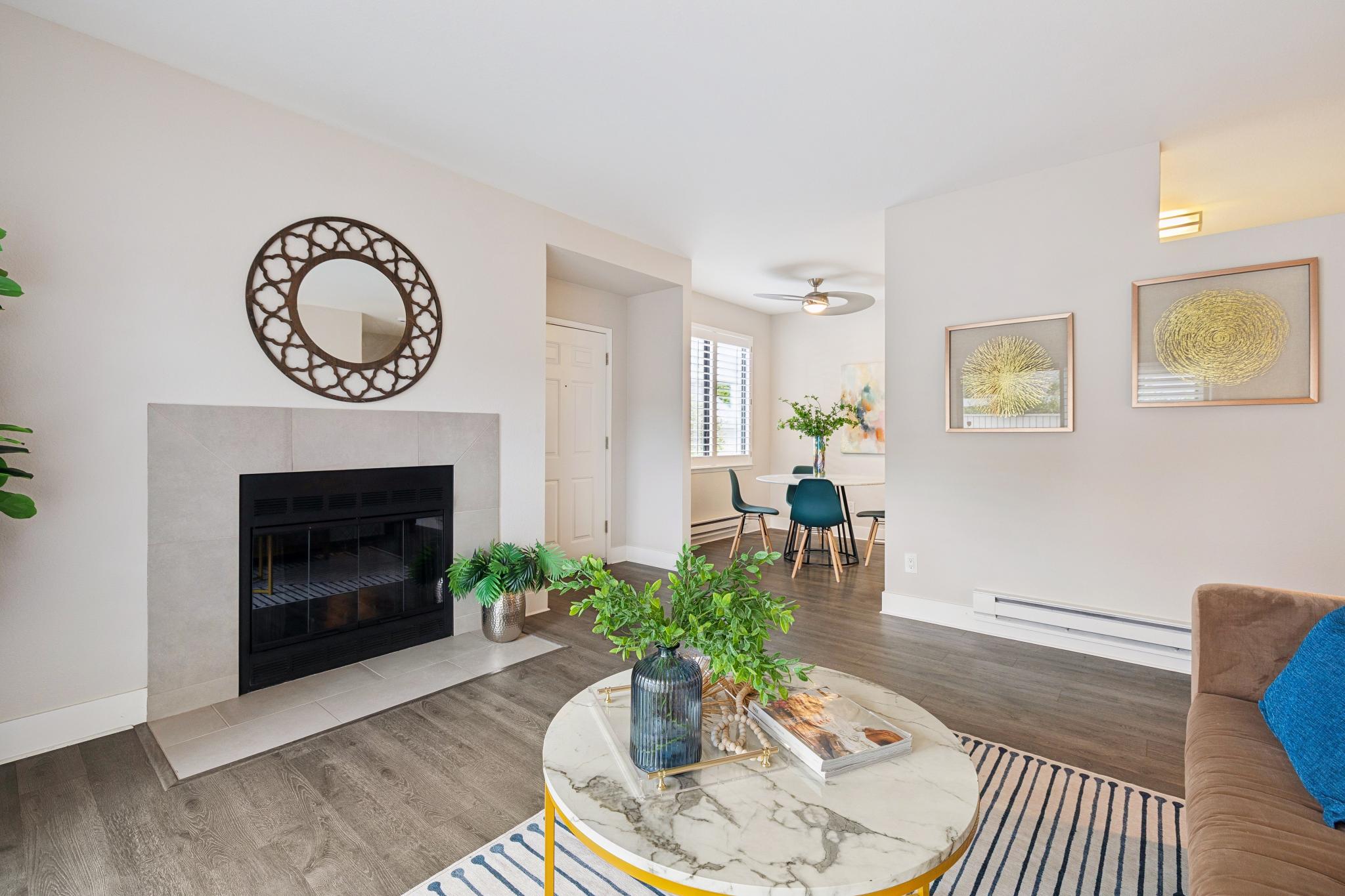Living room and dining area with fireplace at 189 Schooner Ct in Richmond