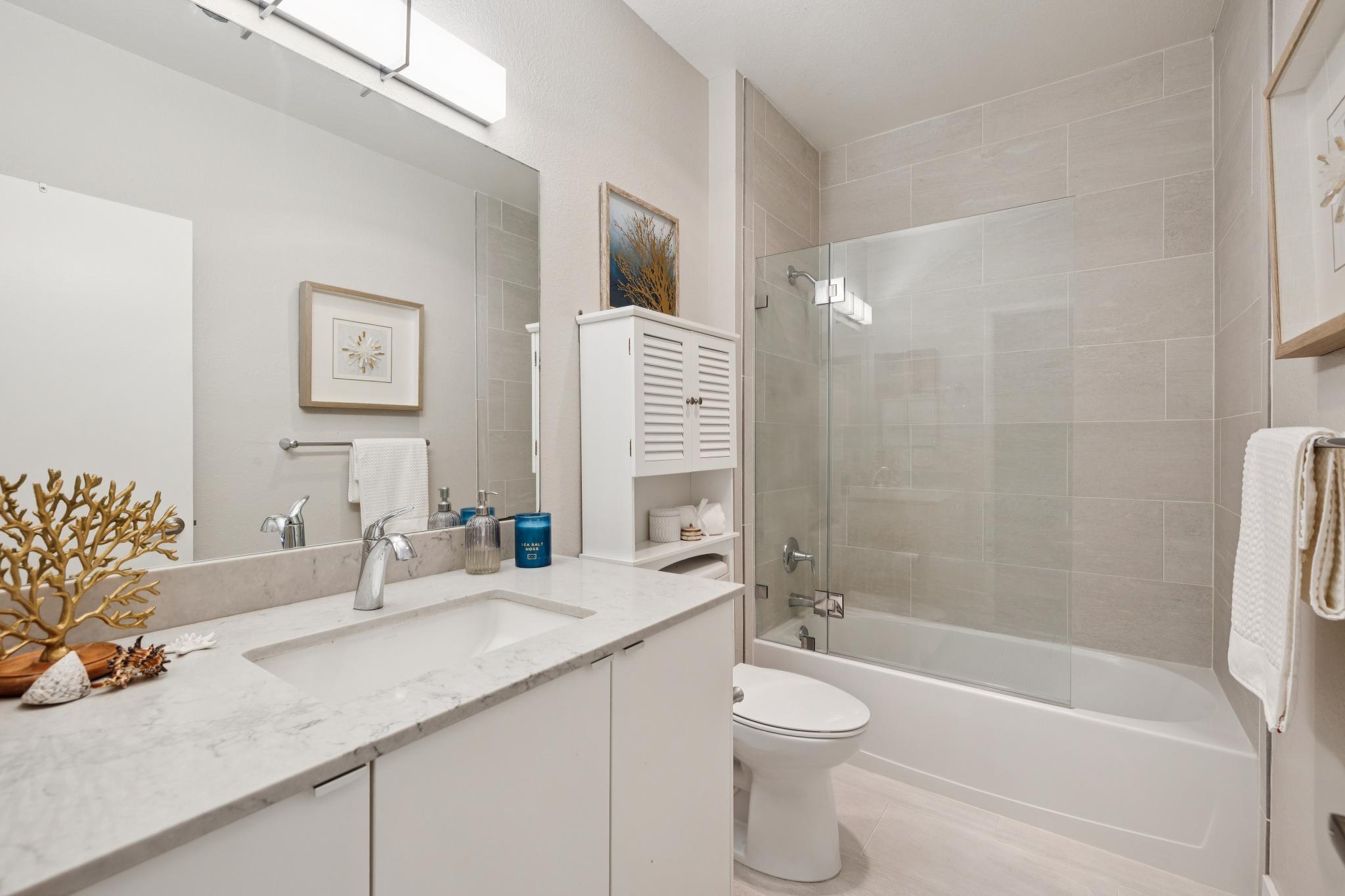 Updated bathroom with shower over tub at 189 Schooner Ct in Richmond