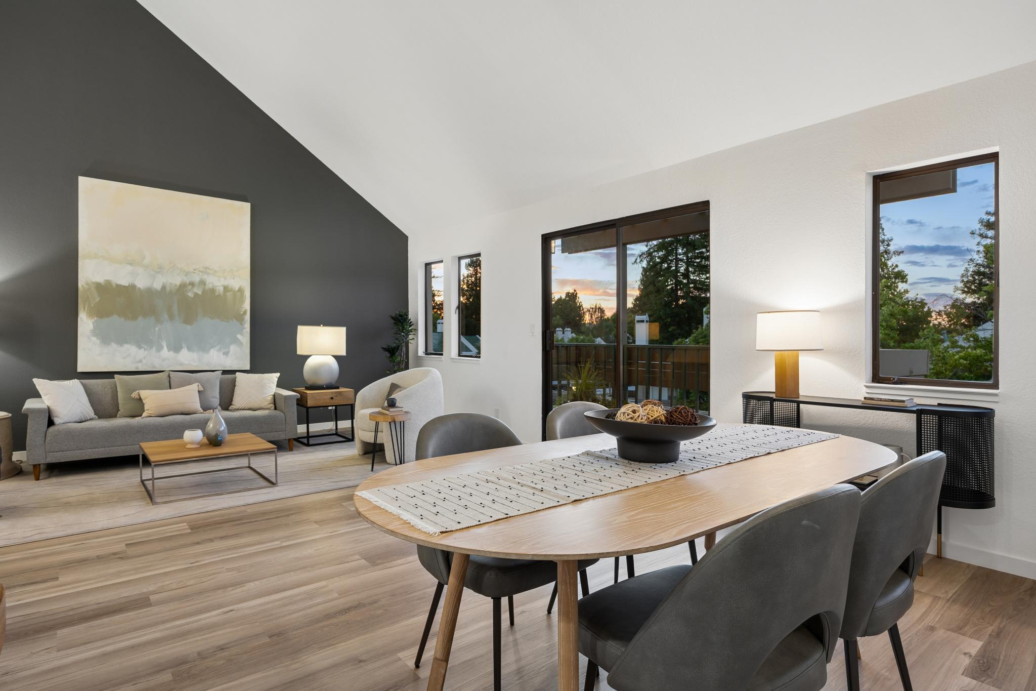 Open living and dining area beneath vaulted ceilings at 36 Mozden Ln