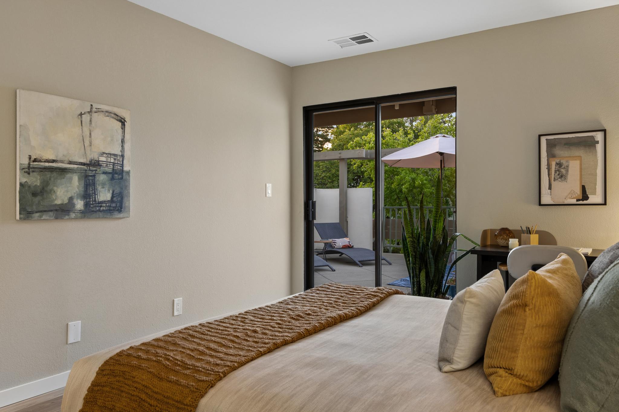 Bedroom with sliding-door patio access at 36 Mozden Ln