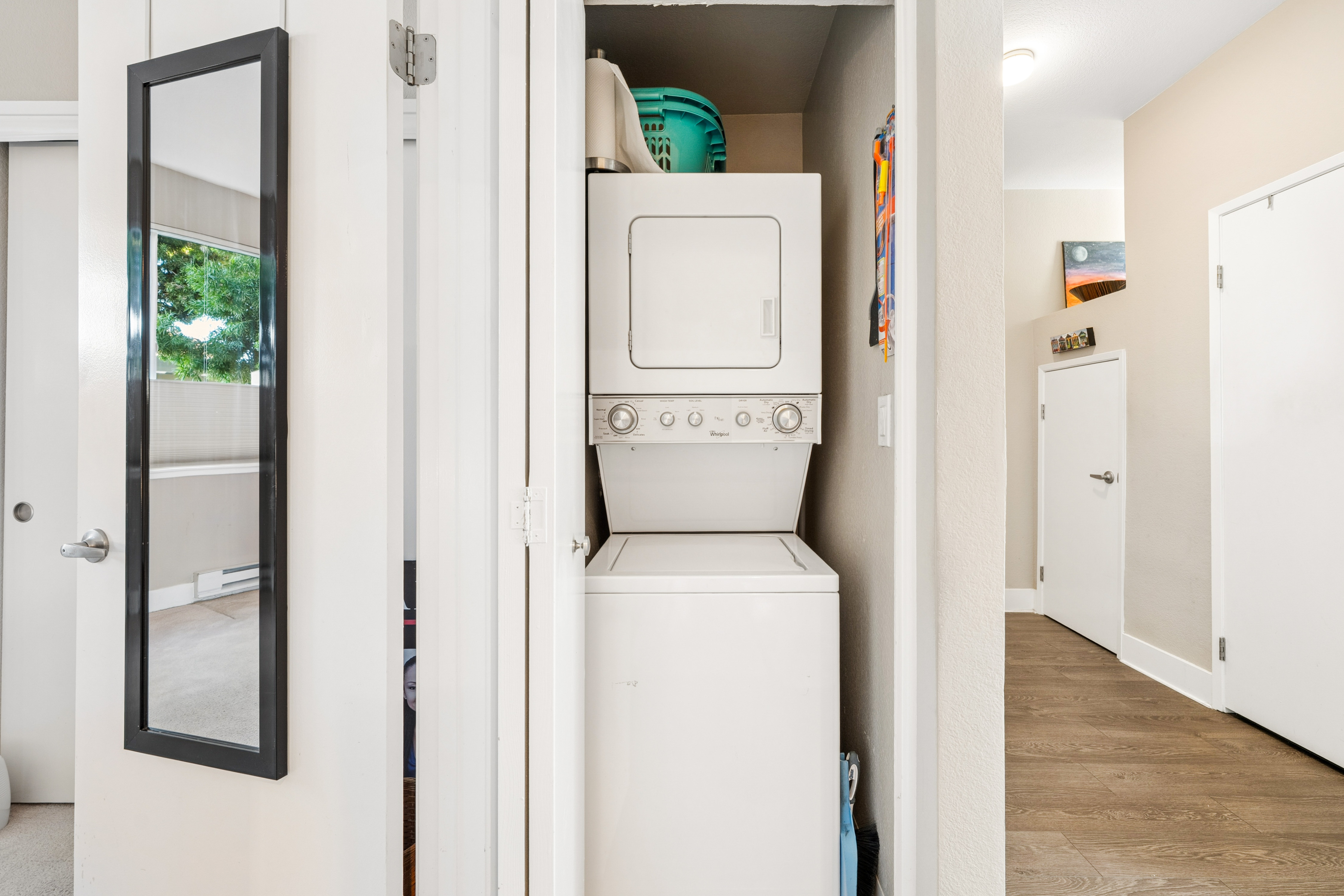 Stacked washer and dryer in the laundry closet at Lakeshore Court in Marina Bay, Richmond