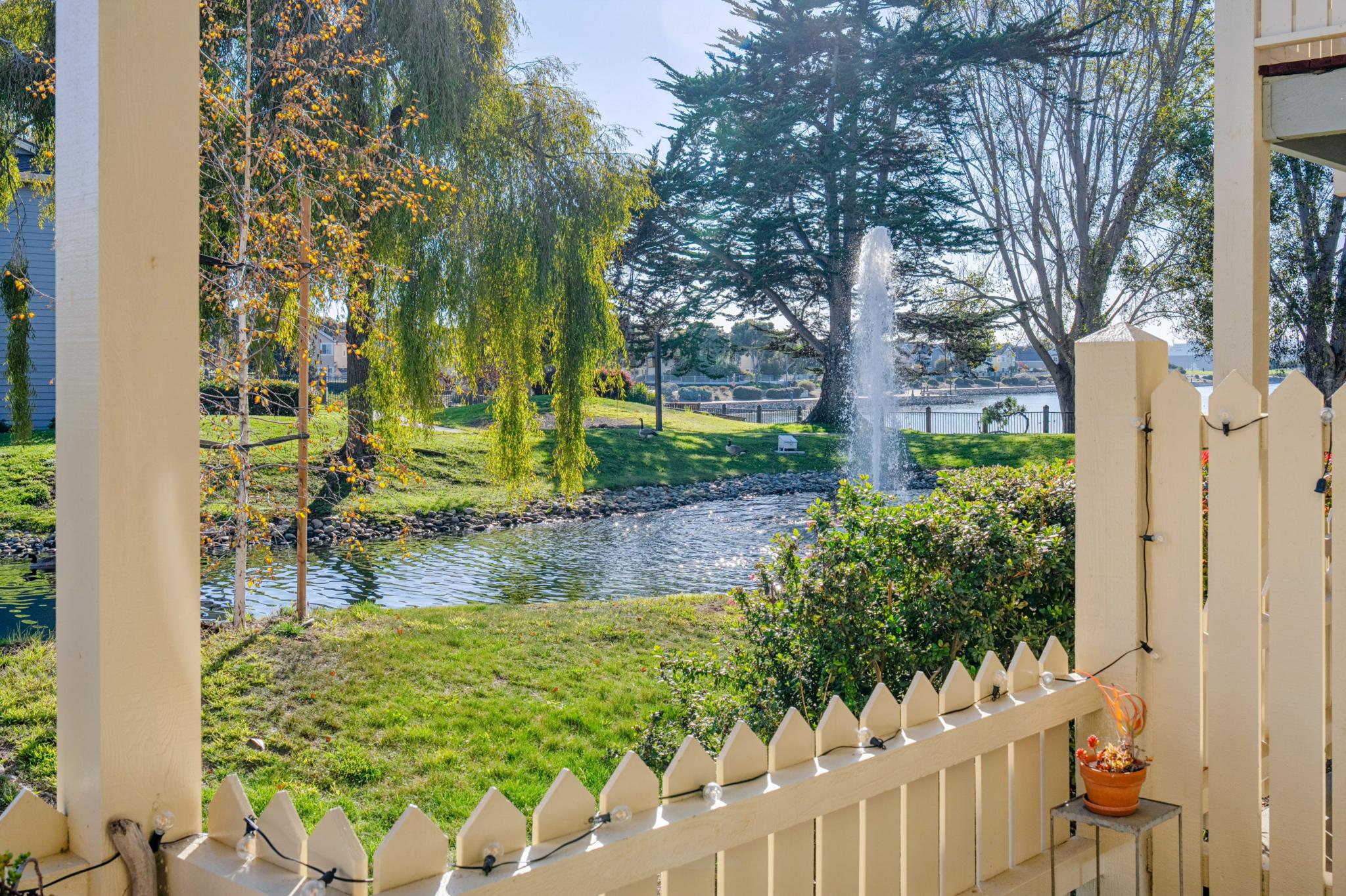Lagoon fountain seen from the covered patio at Lakeshore Court in Marina Bay, Richmond