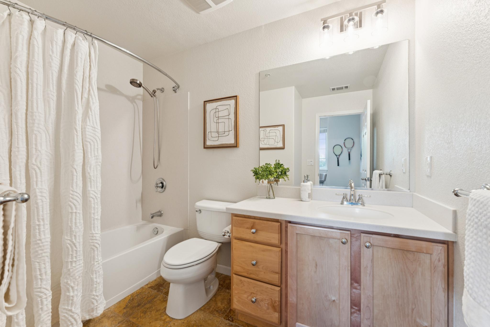 Entry-level full bathroom with a tub and shower at Jetty Drive in Marina Bay, Richmond