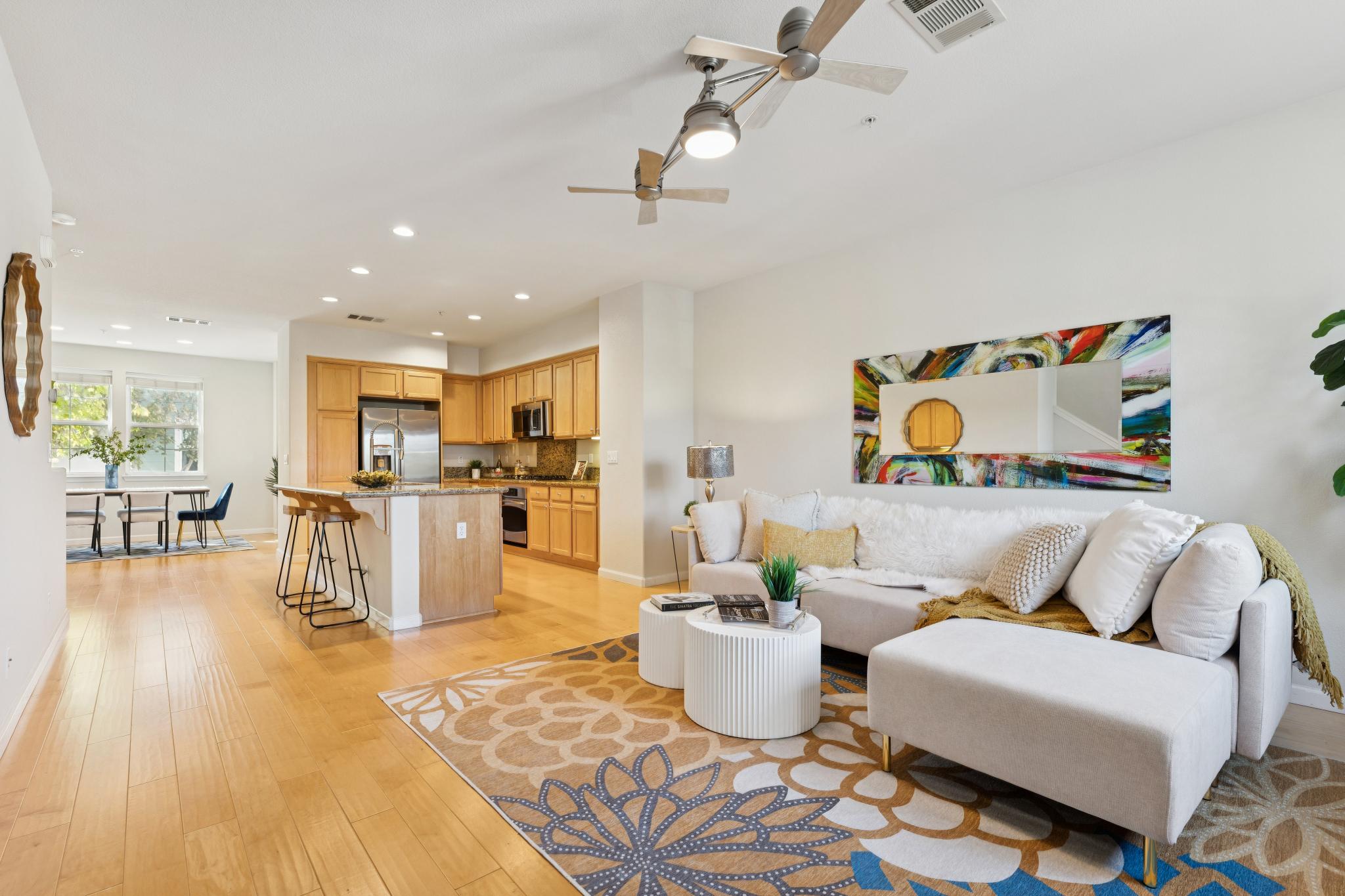 Living room opening to the kitchen and dining area at Jetty Drive in Marina Bay, Richmond