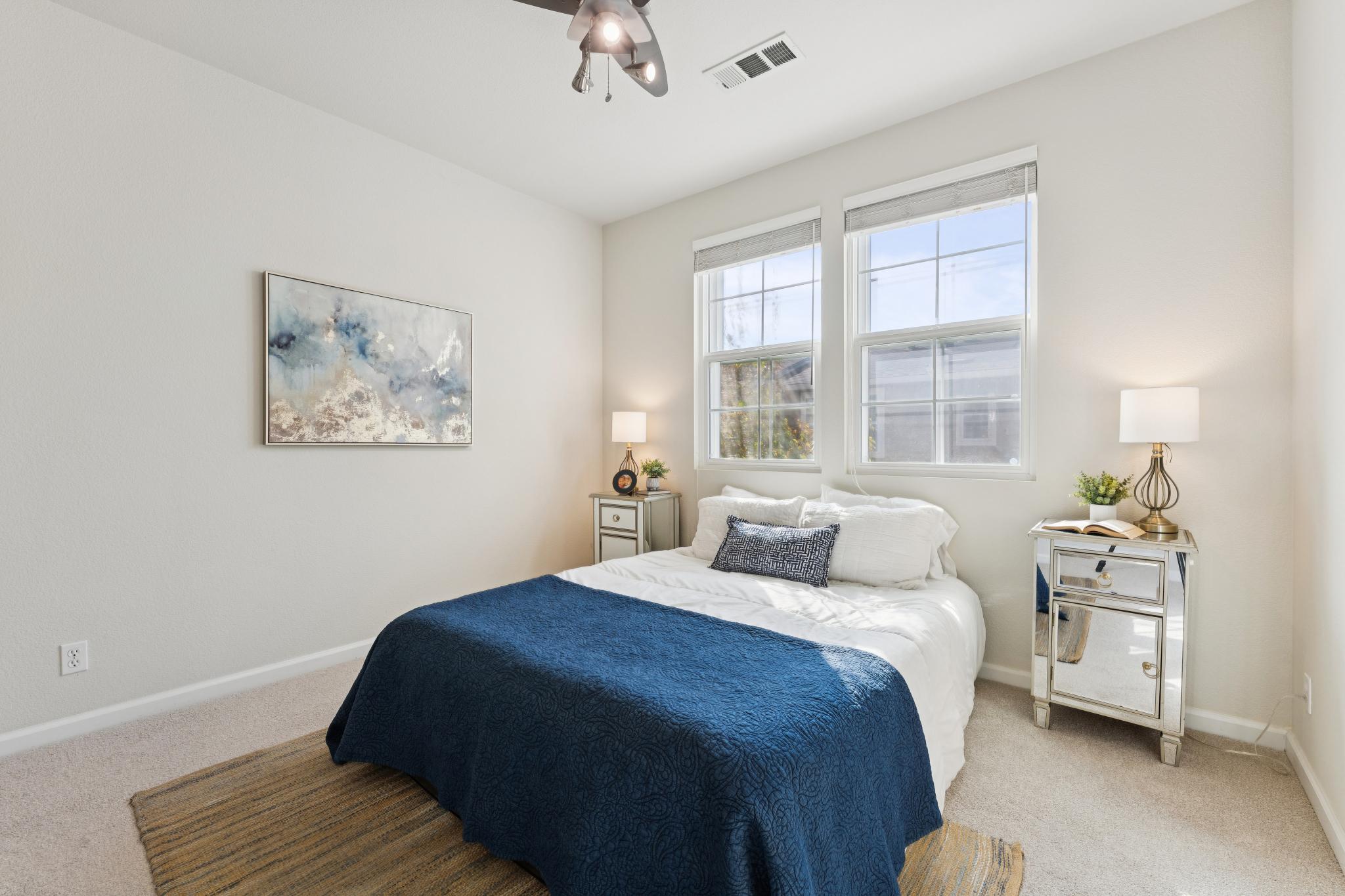 Second upstairs bedroom with windows and carpet at Jetty Drive in Marina Bay, Richmond