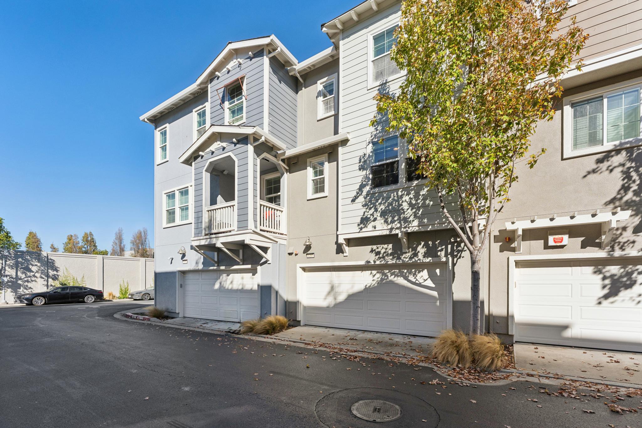 Rear of the home and attached garage access at Jetty Drive in Marina Bay, Richmond