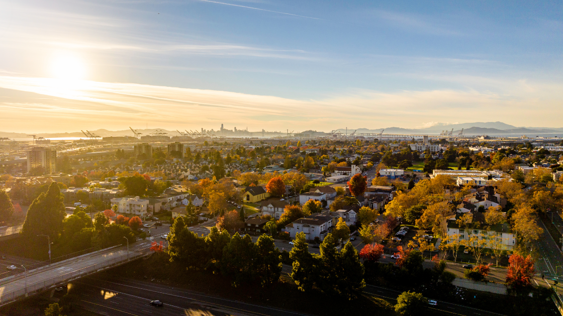 Oakland, California aerial view at sunset for an Oakland condo negotiation guide covering Lake Merritt, Uptown, and Downtown condos