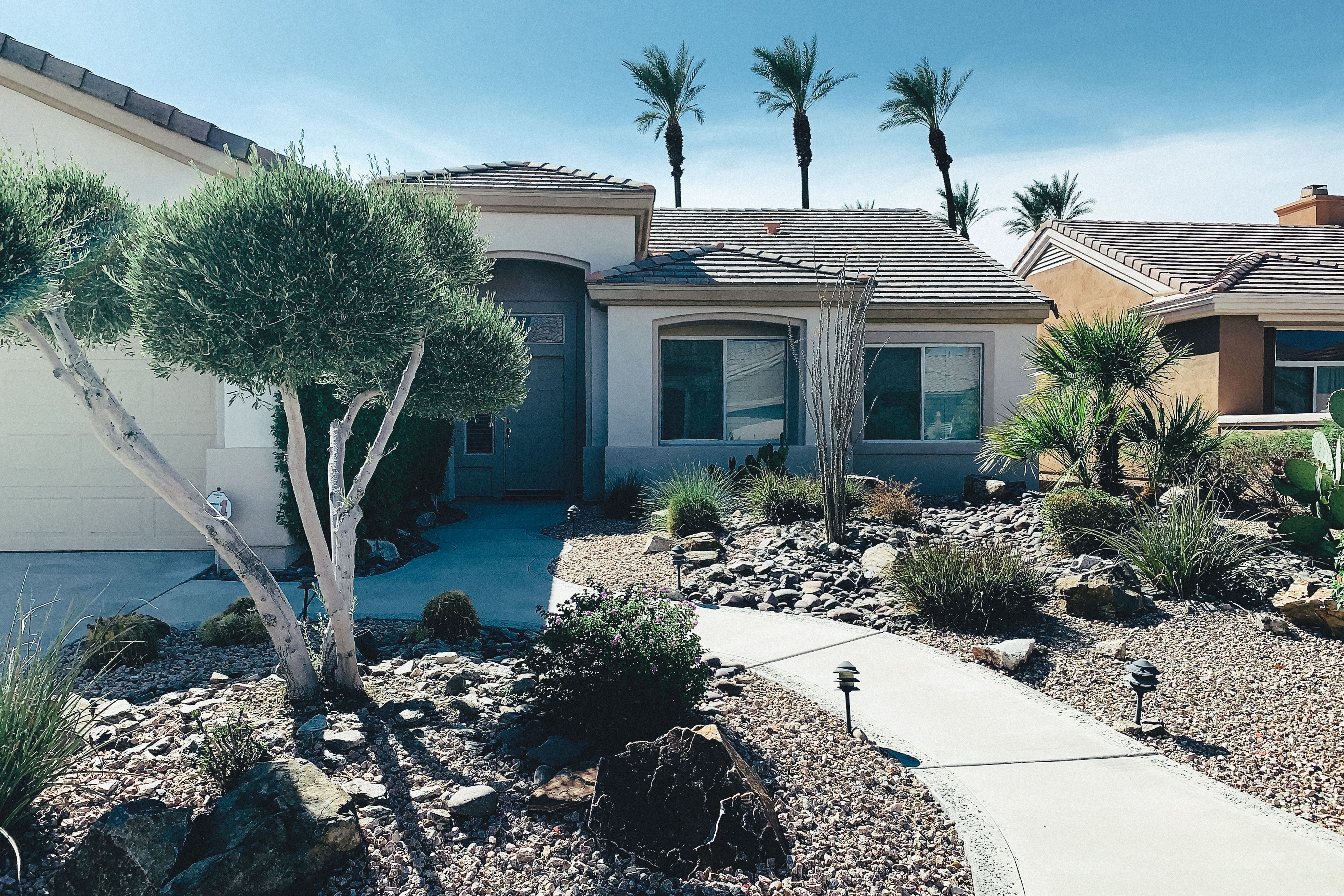 Desert home with gravel, cacti and agave landscaping and no lawn