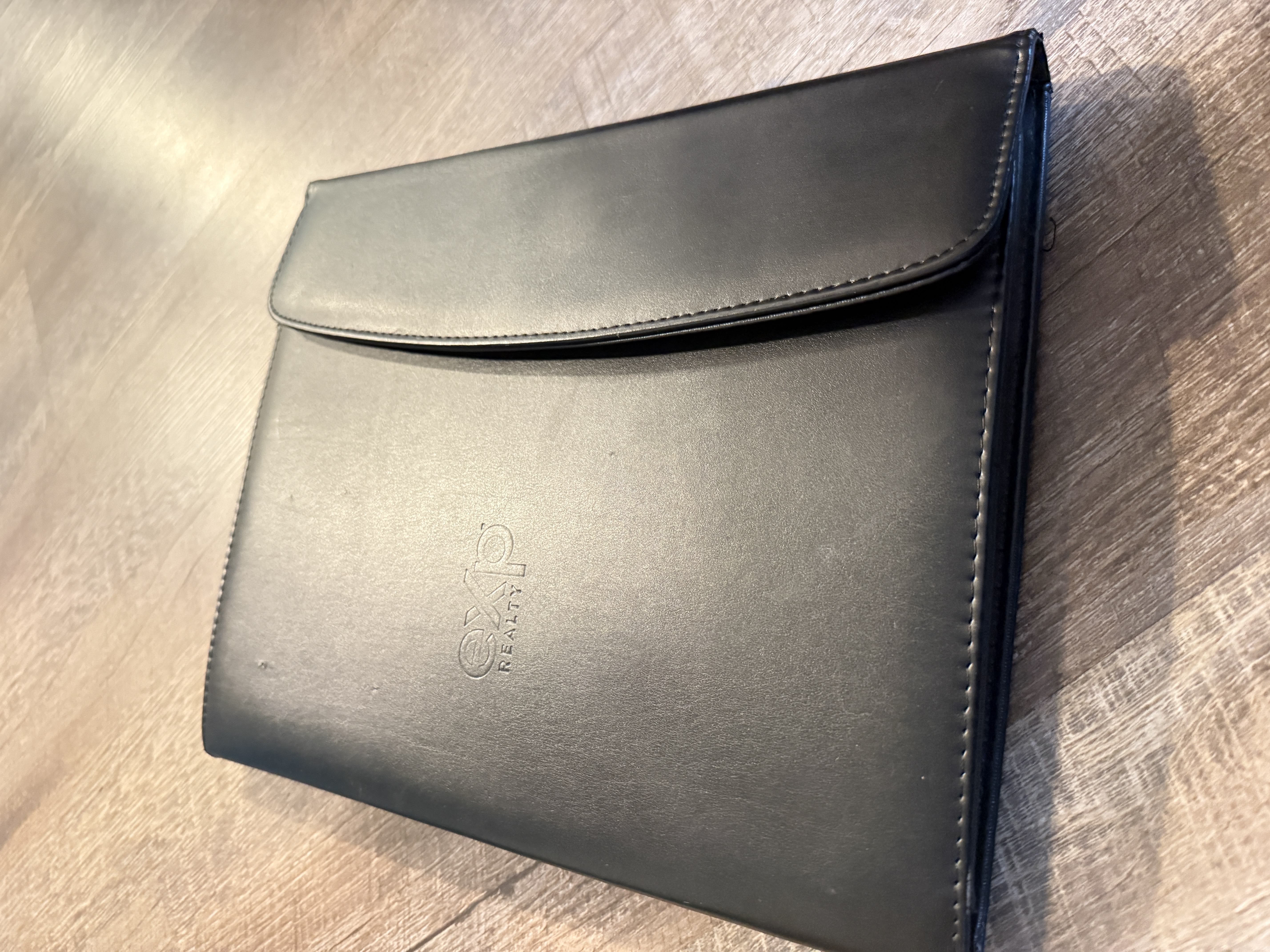 “A clean, professional graphic featuring an open binder labeled ‘Mortgage Lender Options’ on a desk. Inside the binder are neatly organized comparison sheets with icons for interest rates, fees, and loan terms. 