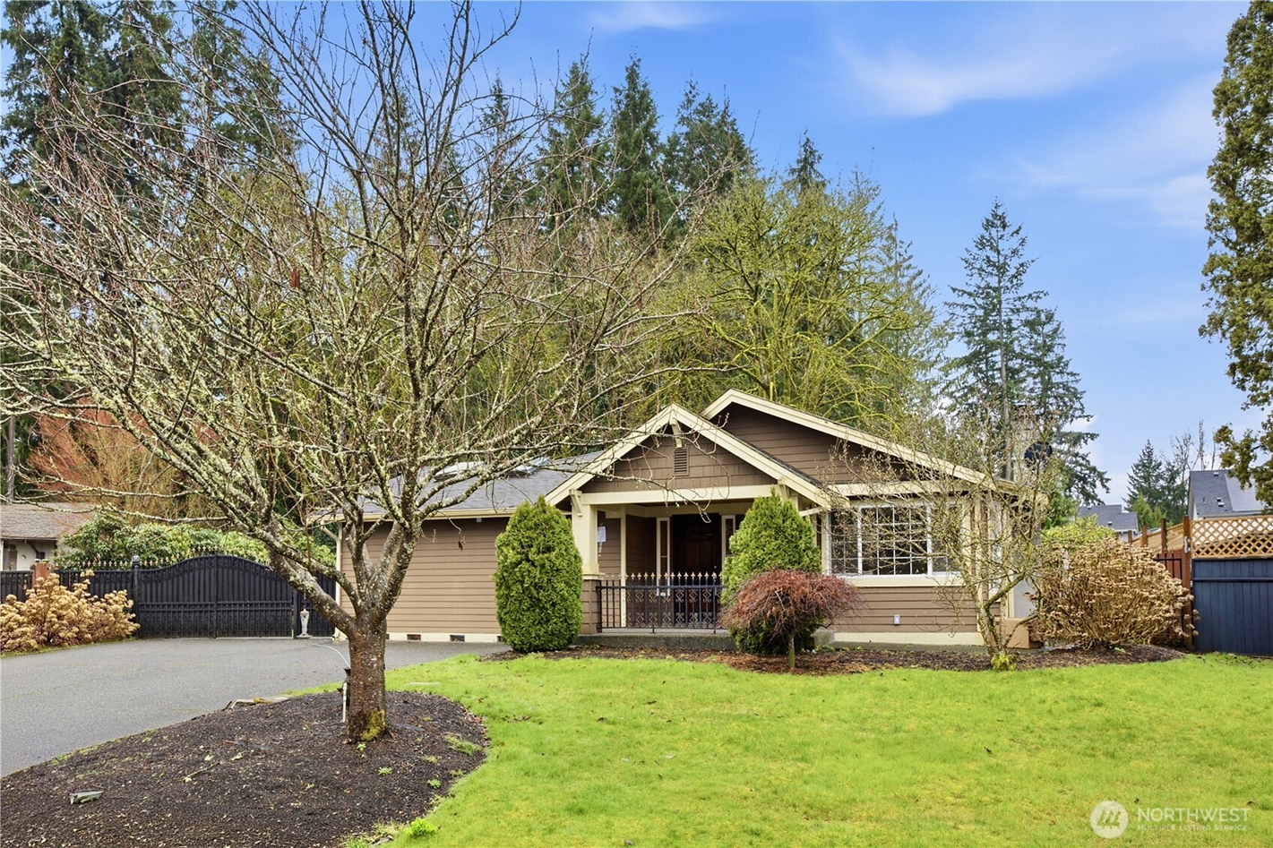 Exterior of a Western Washington home with mature landscaping, representing a rental property being prepared for sale by Redal Homes.