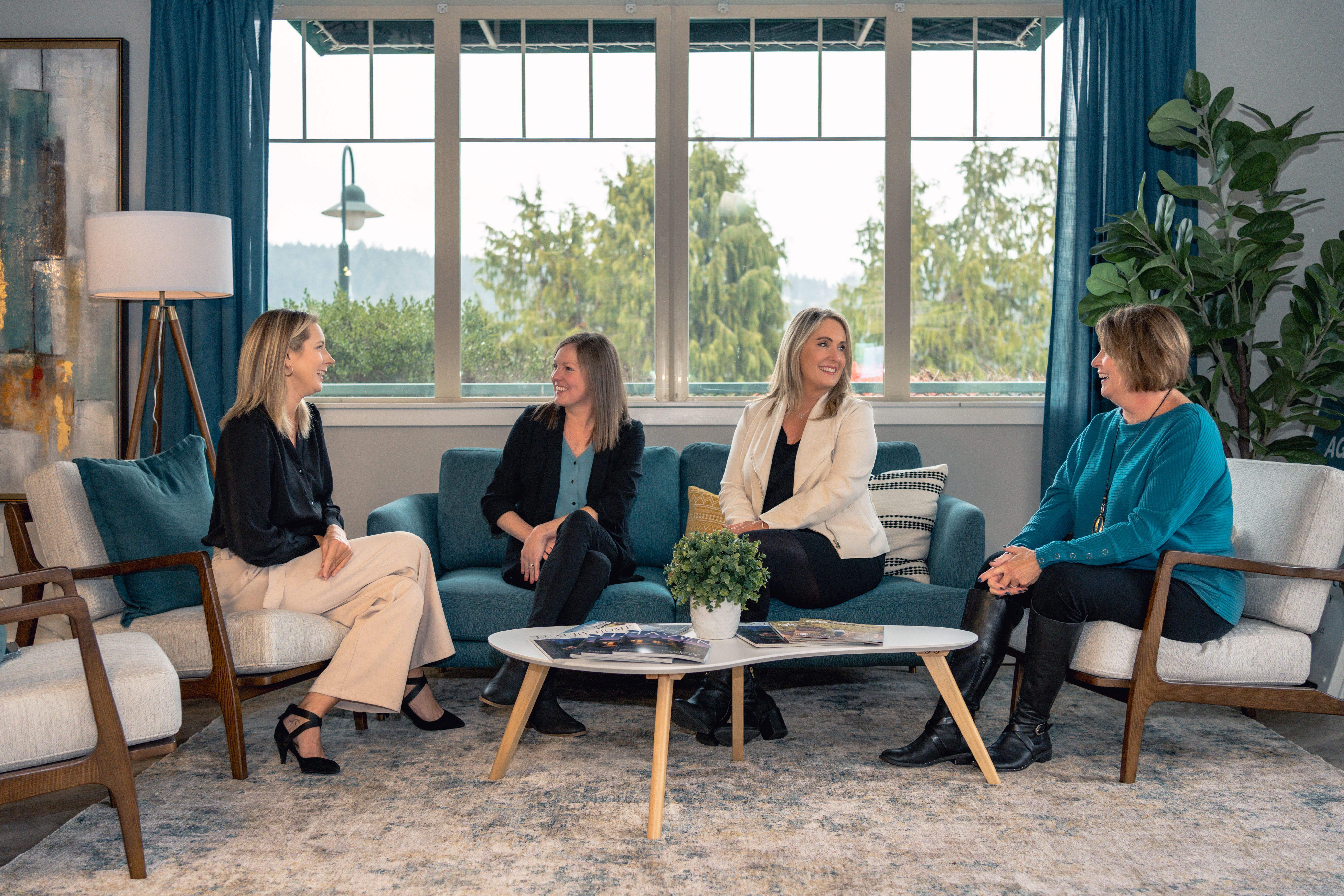 Heather Redal meeting with home buyers during a real estate consultation, demonstrating the personalized guidance and local expertise Redal Homes provides to buyers throughout Gig Harbor, Tacoma, and the South Sound.
