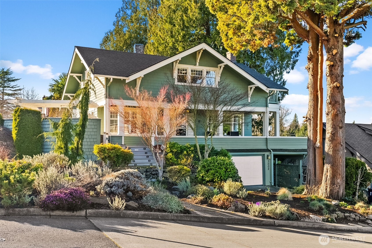 Craftsman-style home with mature landscaping in Gig Harbor, Washington, representing strategic home pricing and expert listing services by Heather Redal and Redal Homes.
