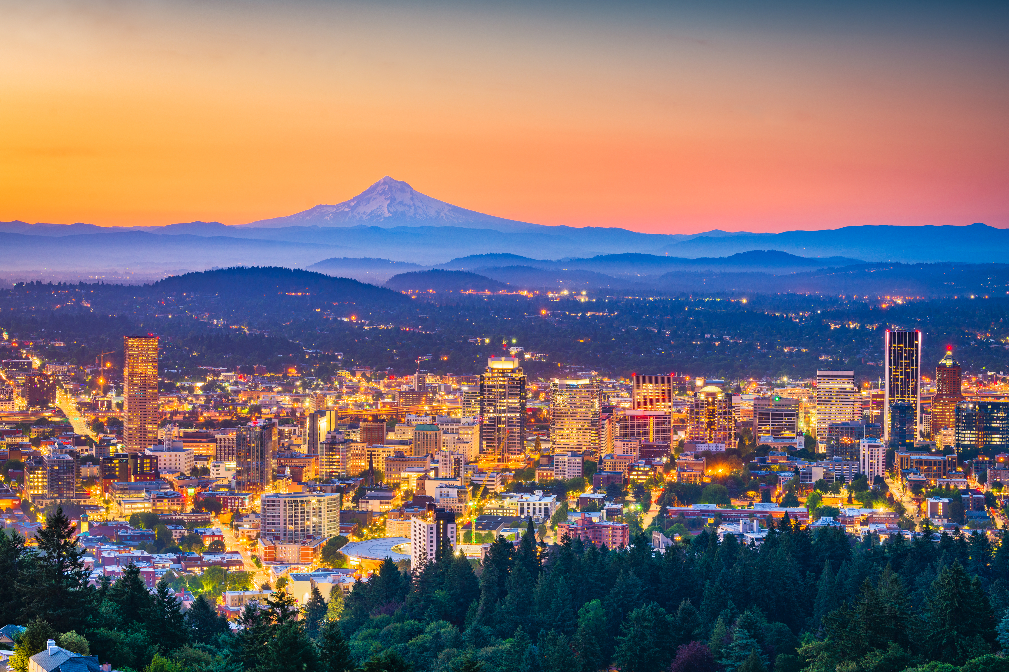 Tacoma skyline in Pierce County Washington with Mount Rainier in the background at sunset, highlighting the region’s real estate and lifestyle appeal