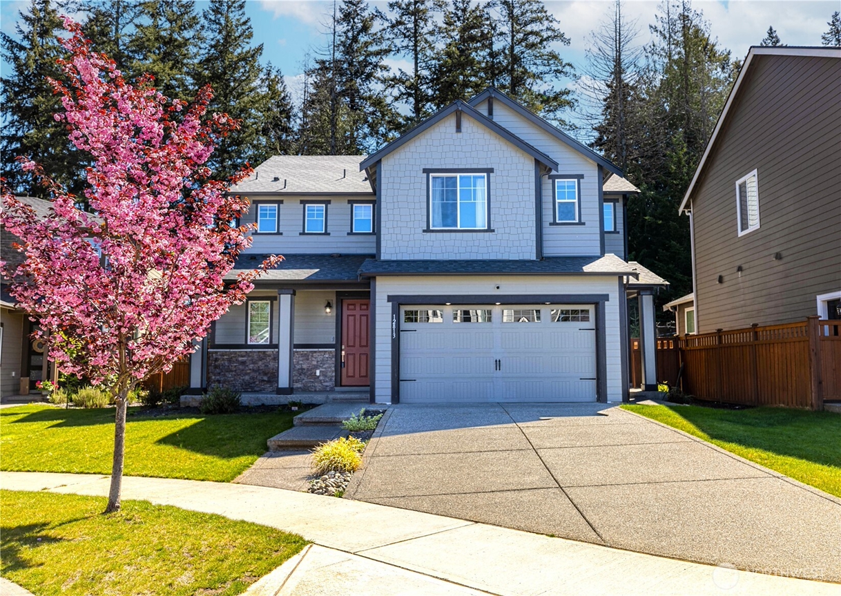 Front exterior of a professionally prepared two-story home in Bonney Lake, Washington, illustrating how strategic home preparation and curb appeal can maximize value before listing with Redal Homes.