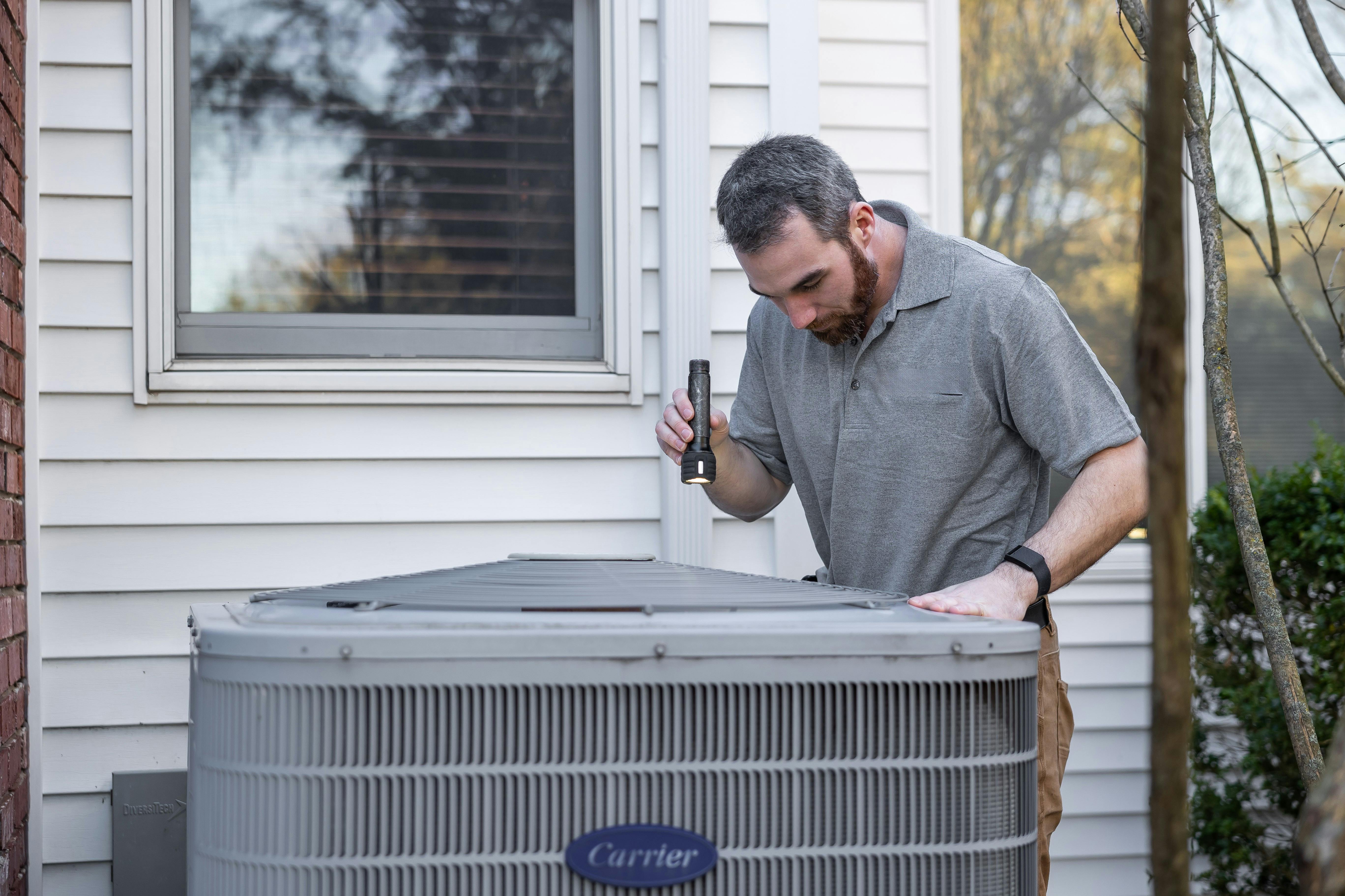 Guy looking at HVAC